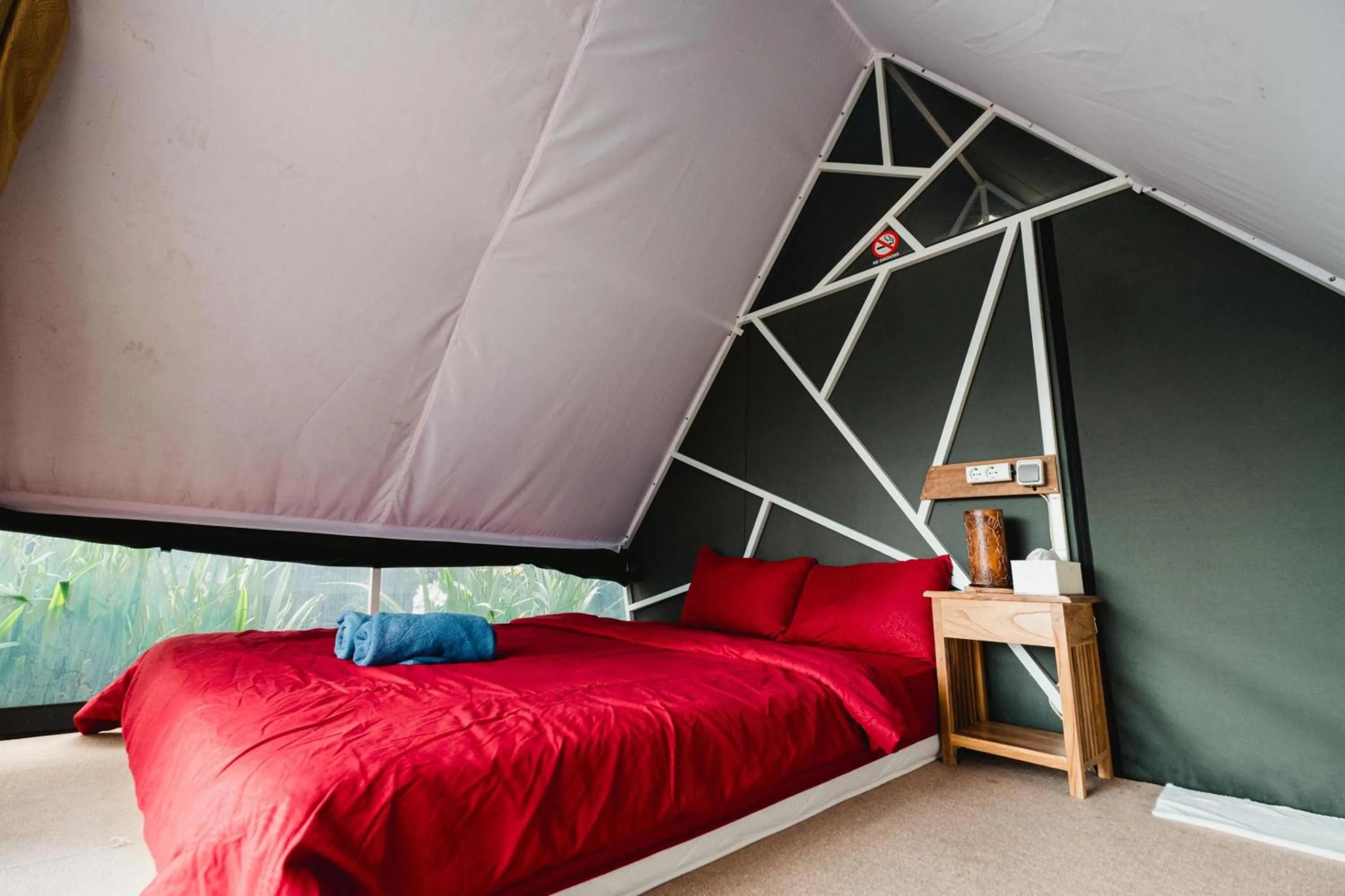 Bed in Popitan Garden Campground & Glamping Bedugul