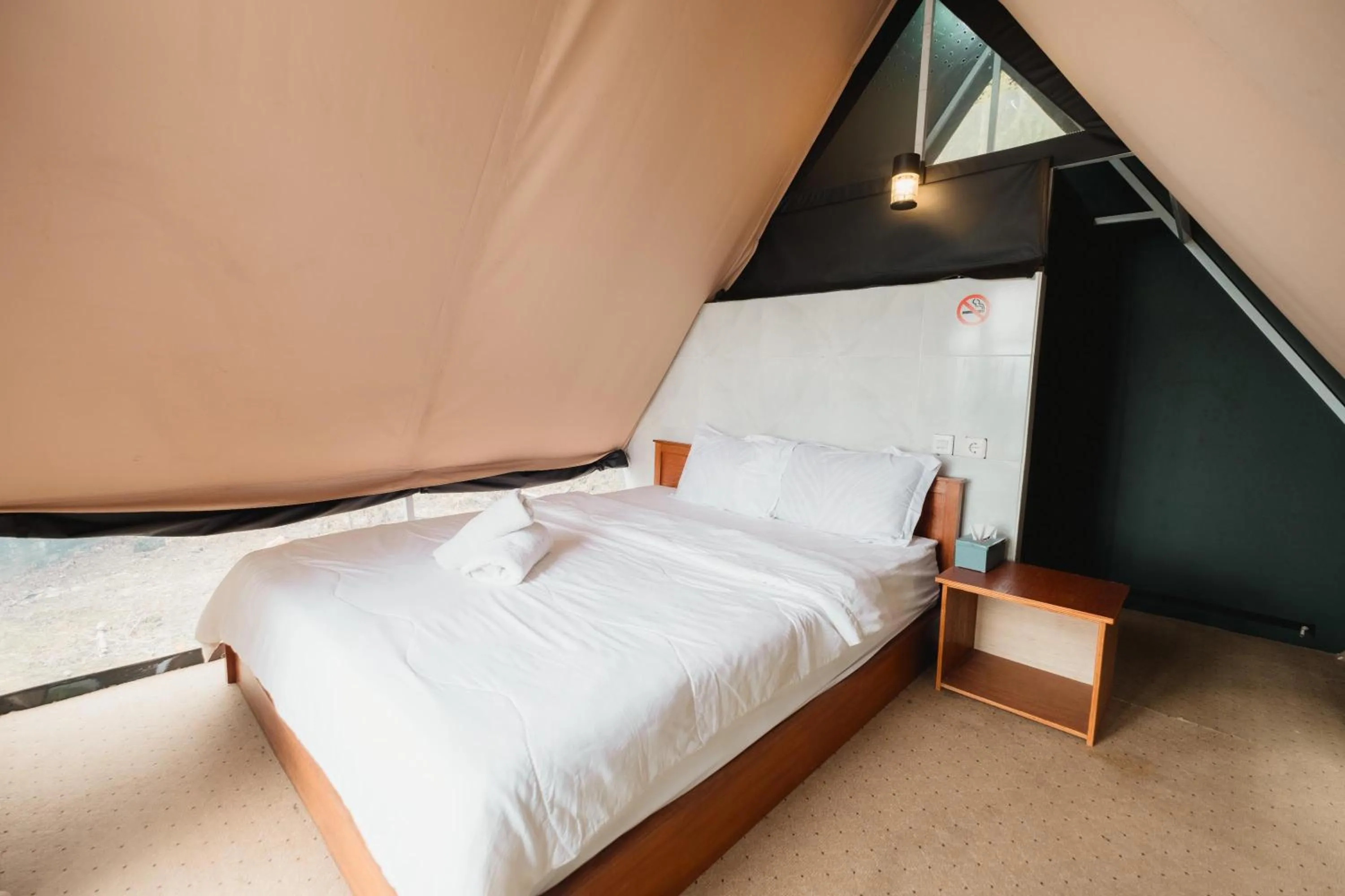 Bed in Popitan Garden Campground & Glamping Bedugul