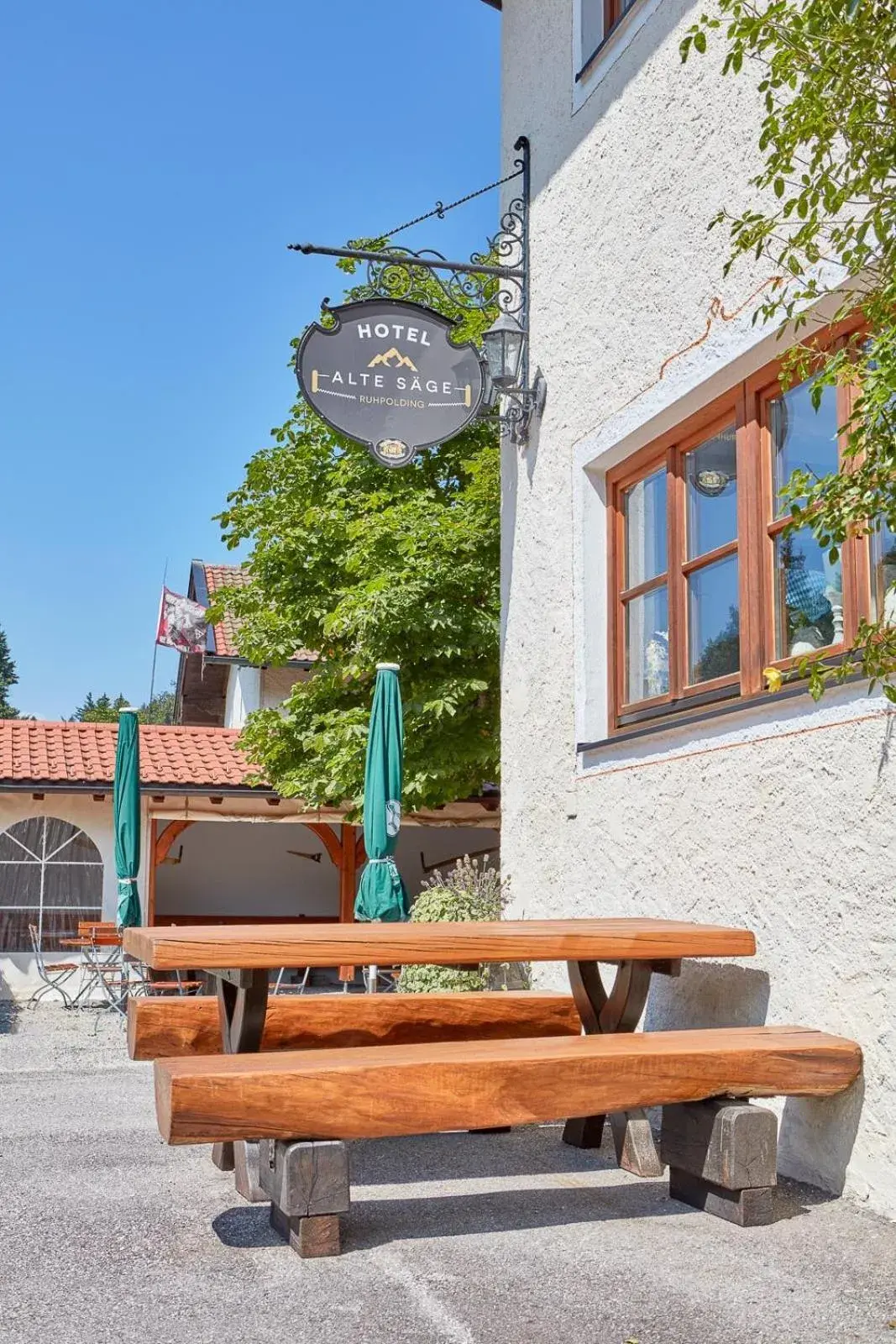 Garden view in Hotel Garni Alte Säge Ruhpolding inkl Chiemgaukarte Garden view in Hotel Garni Alte Säge Ruhpolding inkl Chiemgaukarte