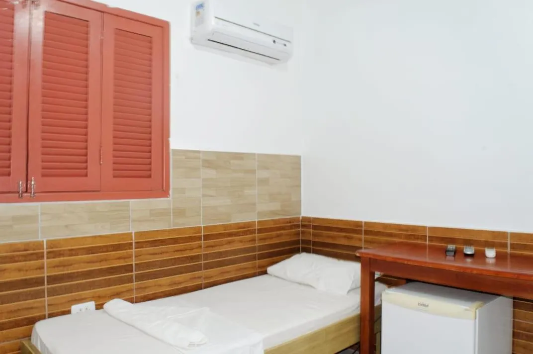 Bed in Pousada Recanto do Amanhecer