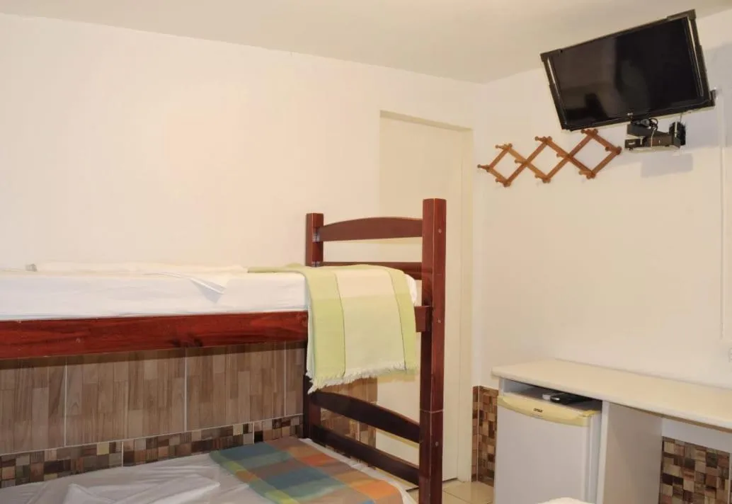 Bed in Pousada Recanto do Amanhecer