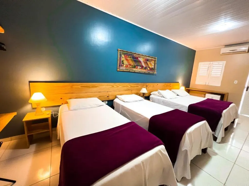 Bed in Pousada Maresia