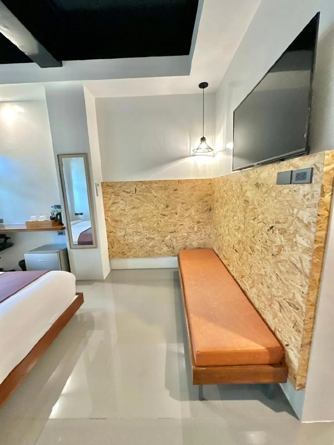 Seating area, Bed in Koze Suites