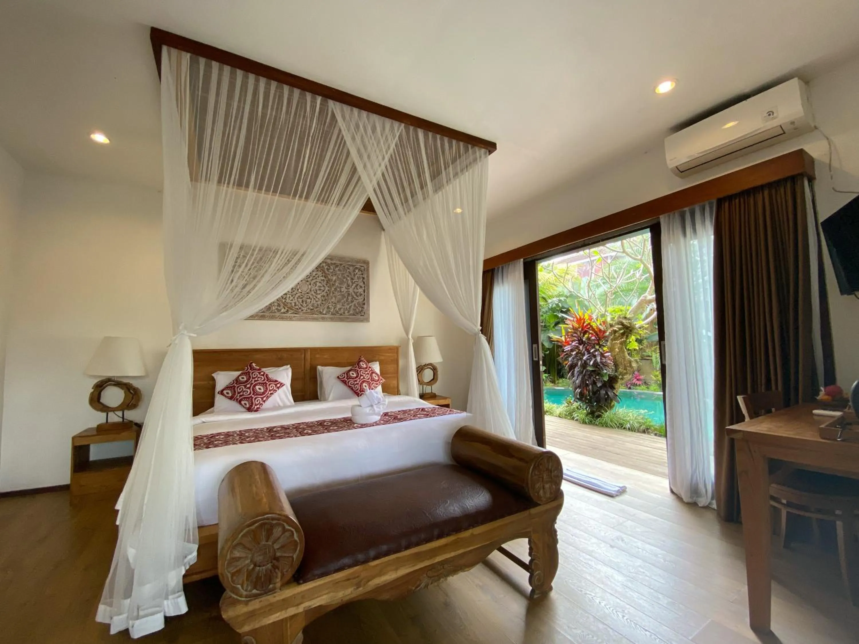 Communal lounge/ TV room, Bed in Uma Linggah Resort by Puri Signatures