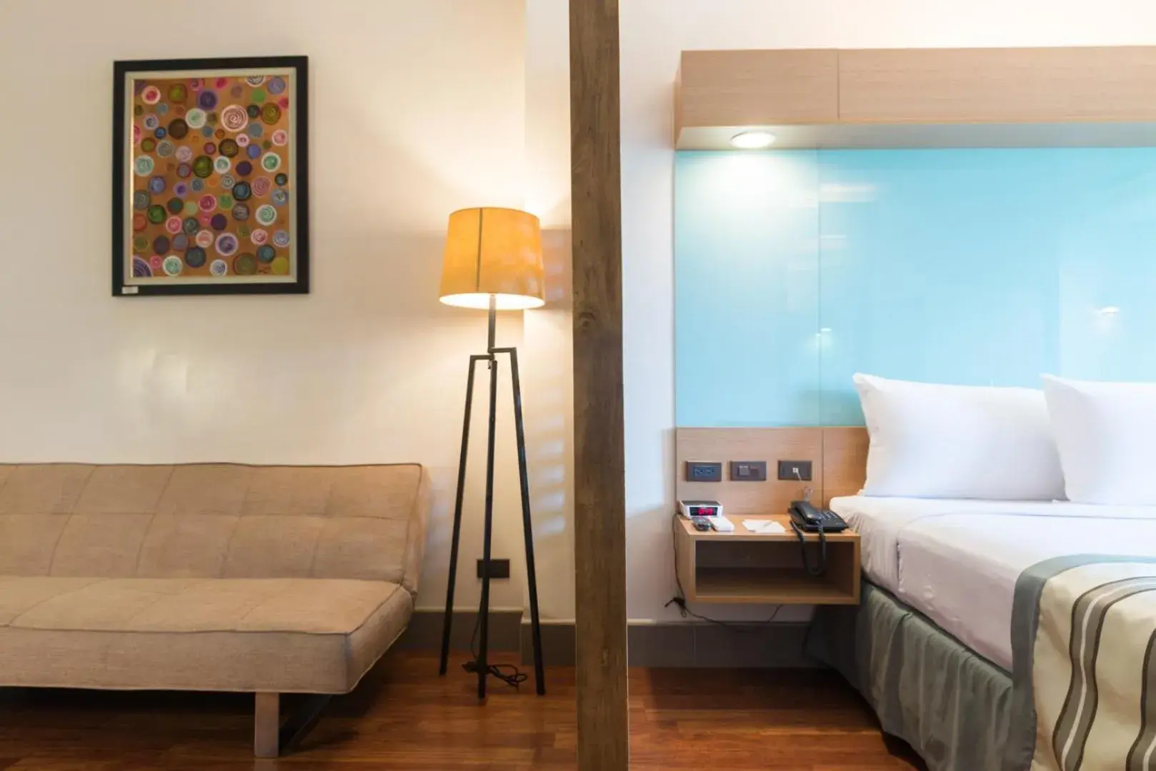 Living room, Bed in Microtel by Wyndham South Forbes near Nuvali Living room, Bed in Microtel by Wyndham South Forbes near Nuvali