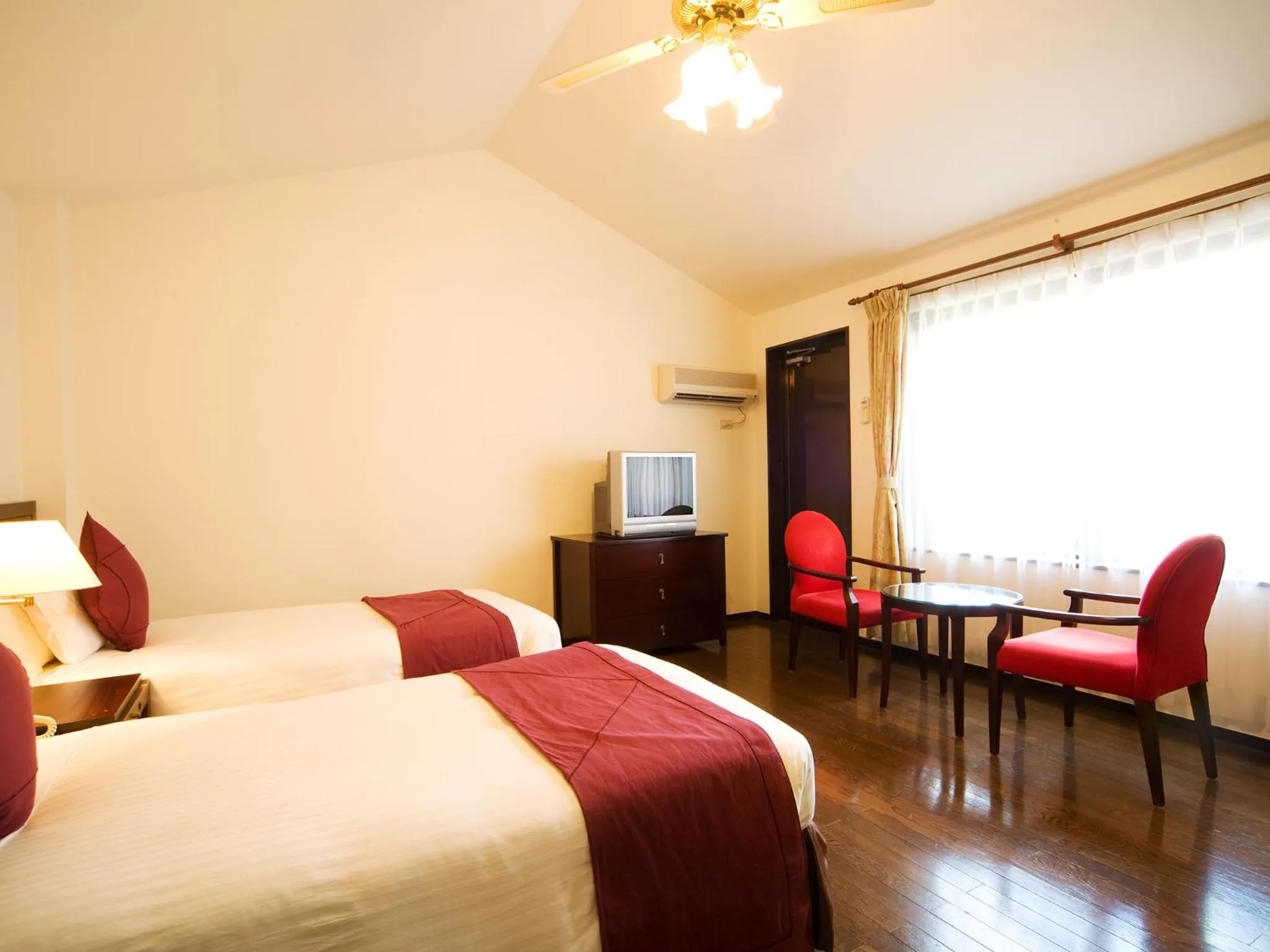 Photo of the whole room, Bed in Coco Garden Resort Okinawa