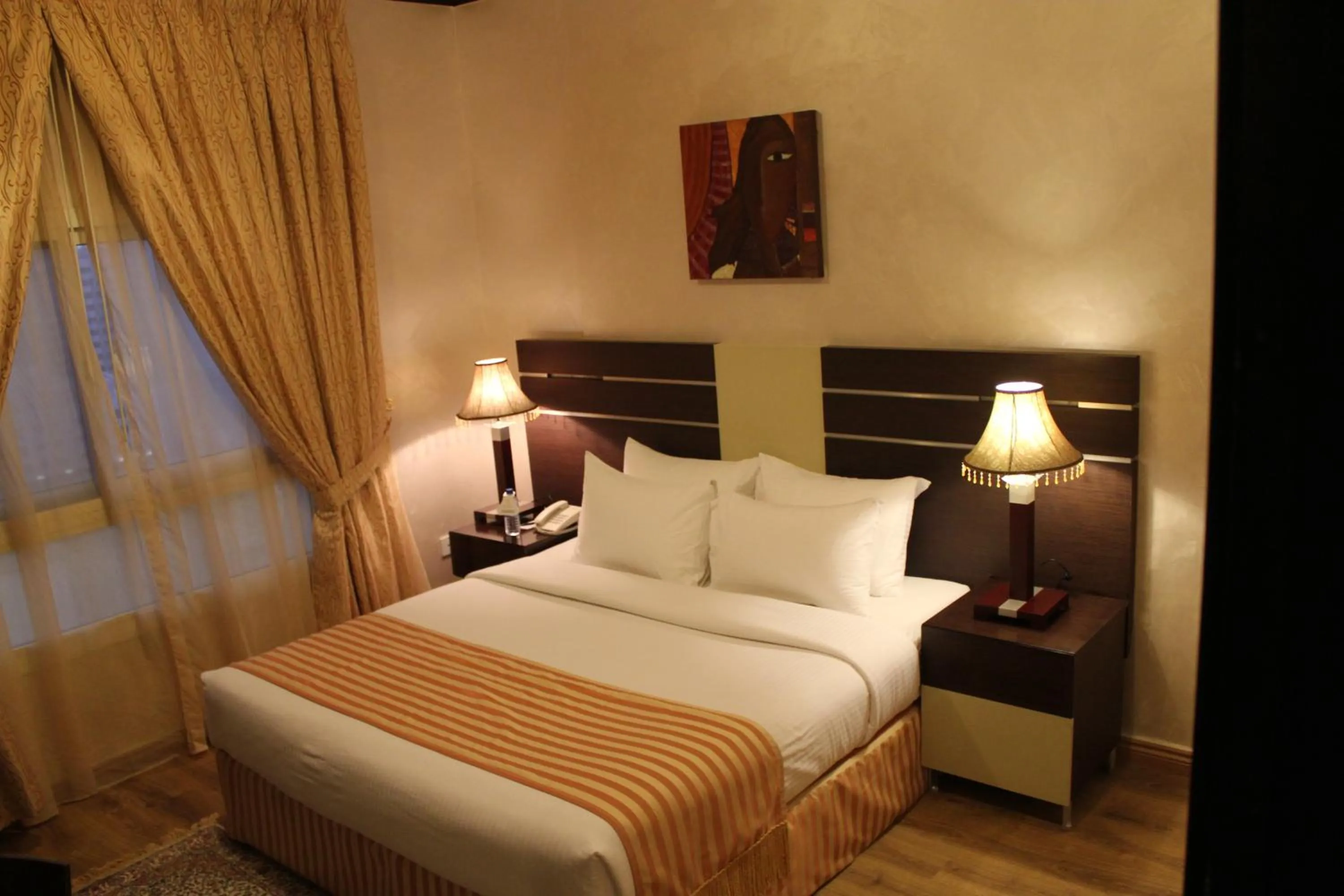 Bed in Boulevard City Suites Hotel Apartments