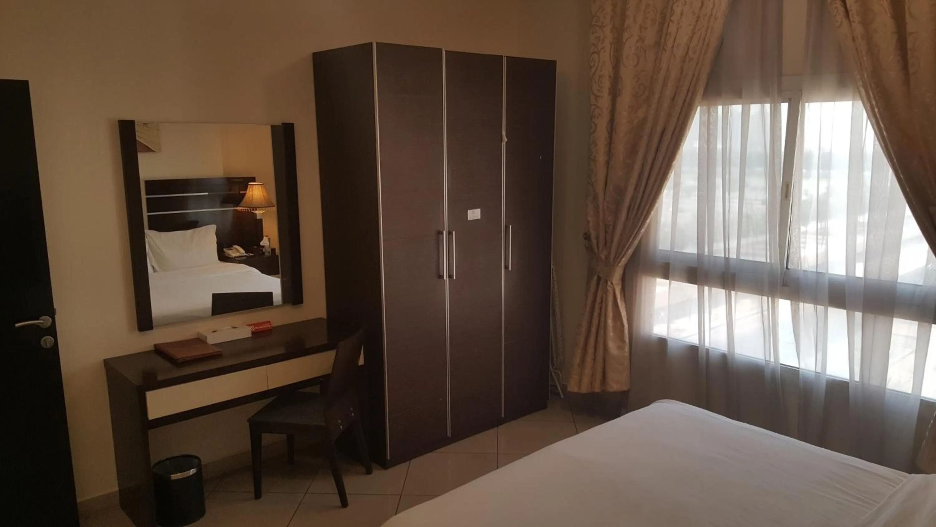 Bed in Boulevard City Suites Hotel Apartments