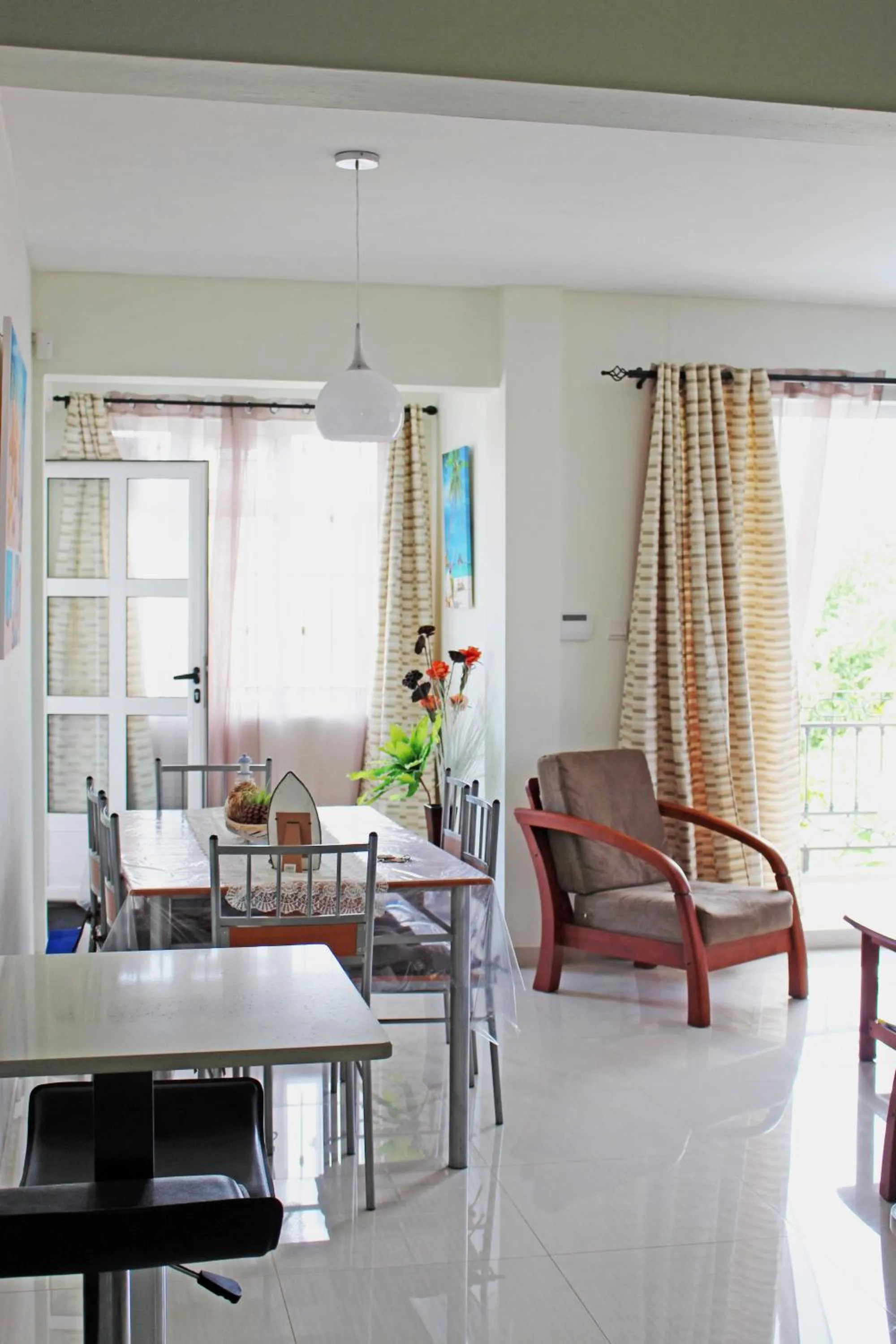 Communal lounge/ TV room in Twins Apartments Flic en Flac Beach