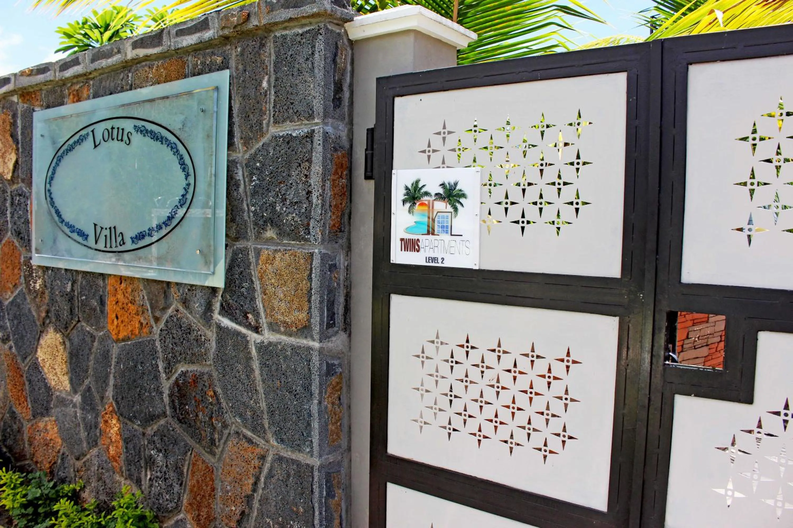 Property logo or sign in Twins Apartments Flic en Flac Beach