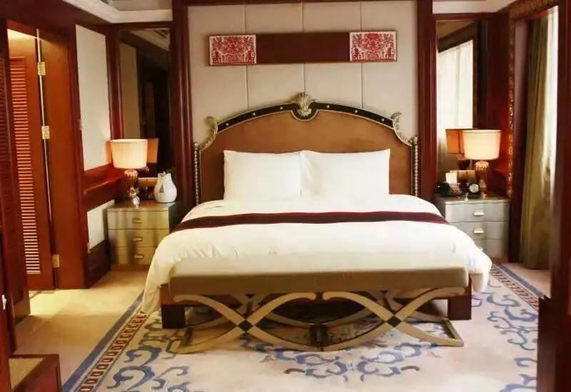Bed in Dynasty International Hotel Dalian