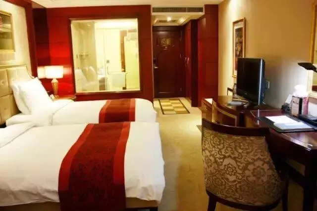 Bed in Dynasty International Hotel Dalian