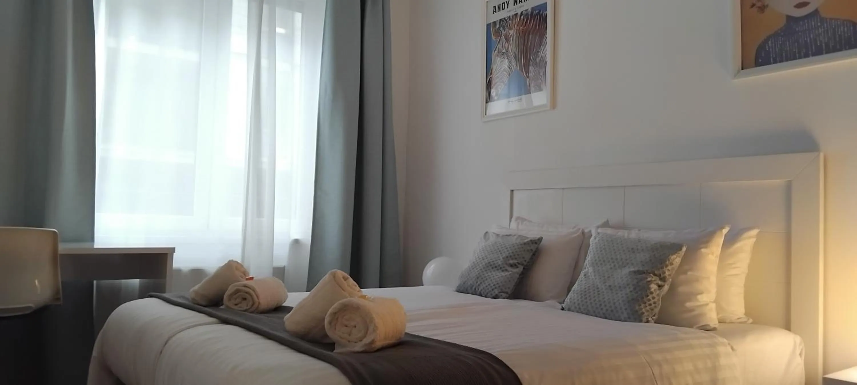 Bed in Corvin Center Suites