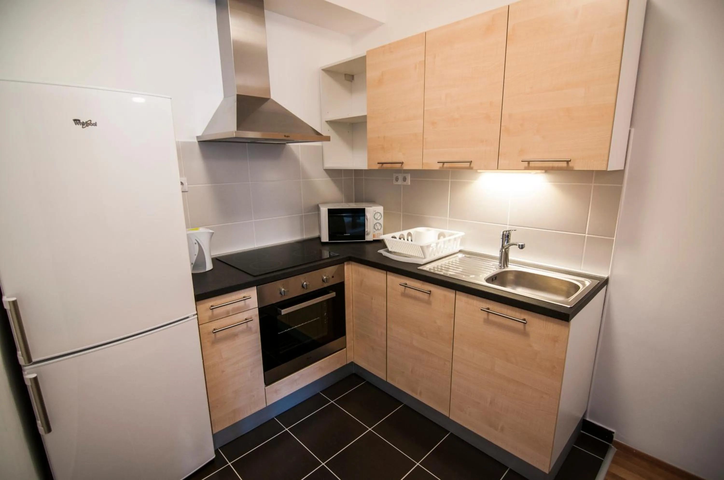 Kitchen or kitchenette in Corvin Center Suites