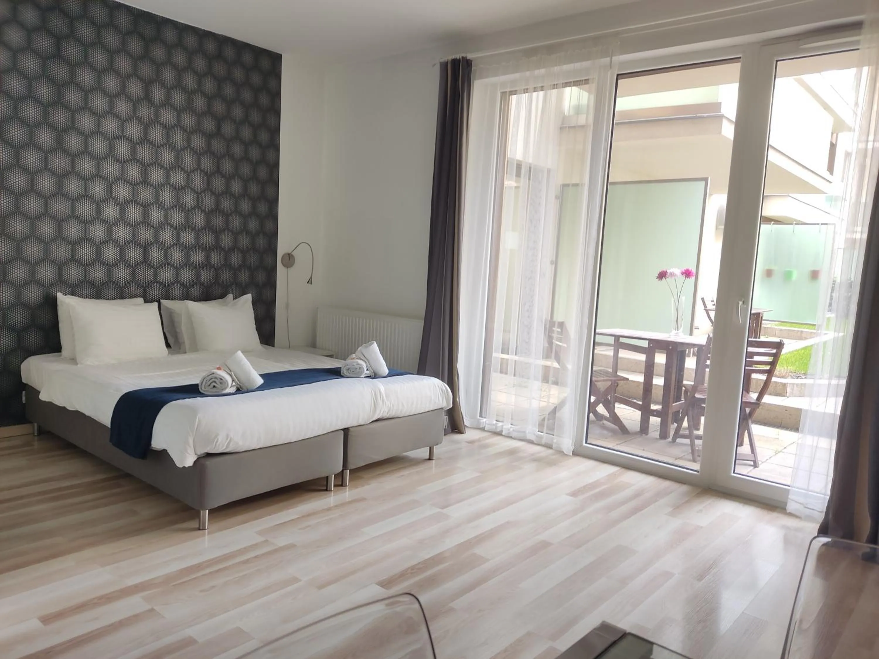 Bed in Corvin Center Suites