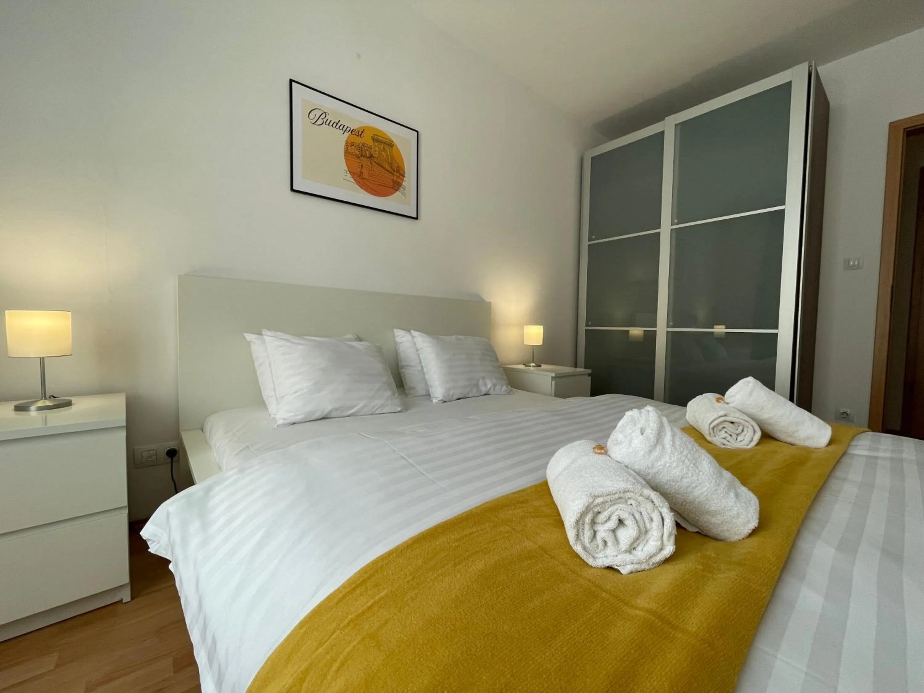 Bed in Corvin Center Suites