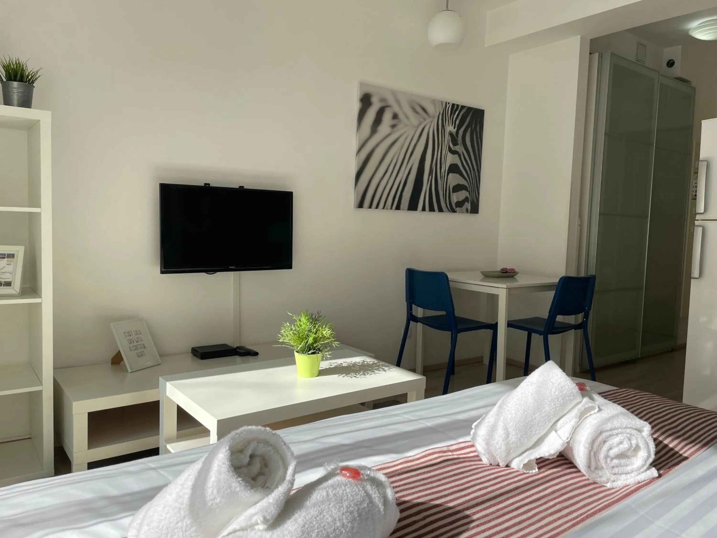 Bed in Corvin Center Suites