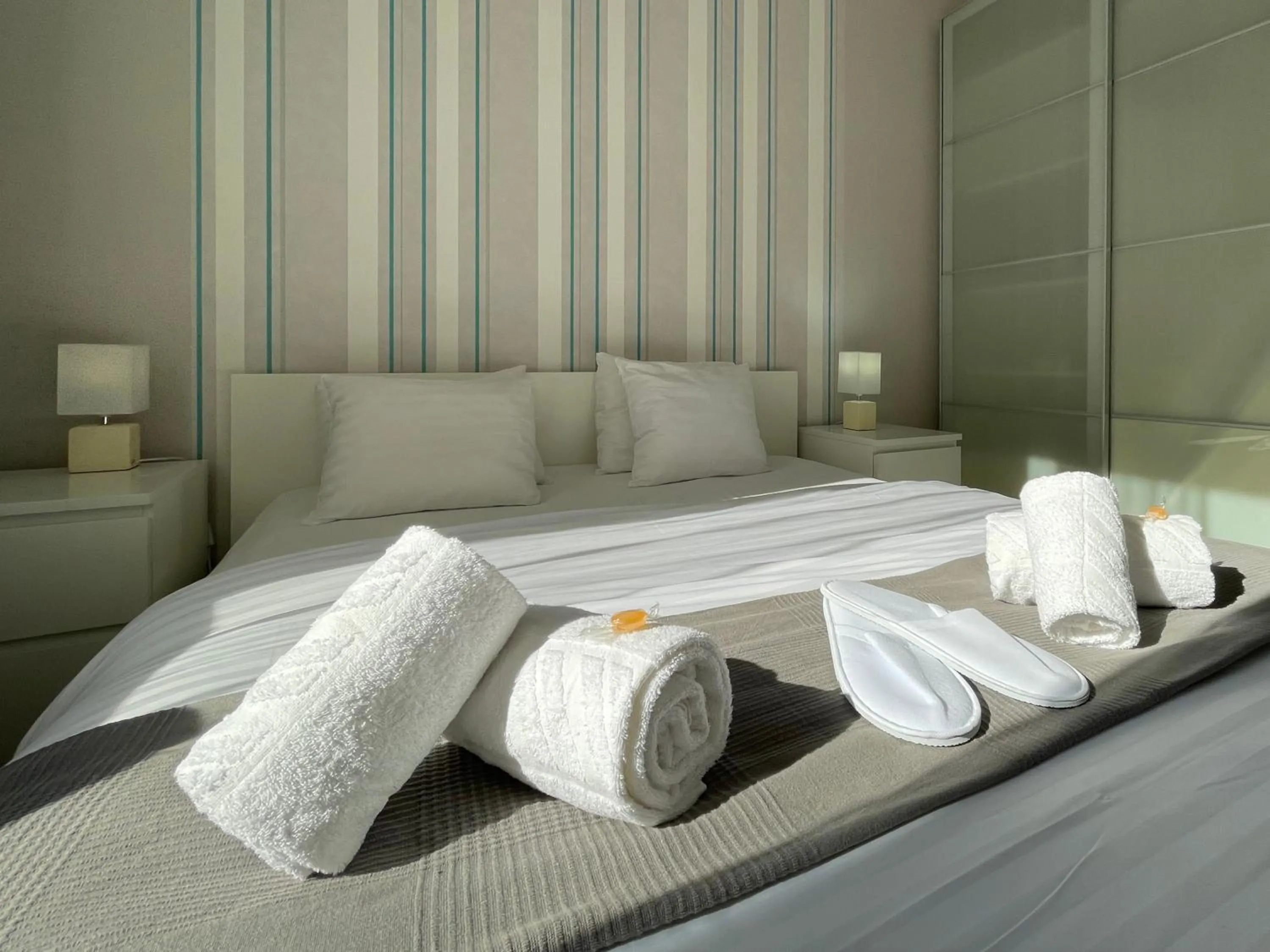 Bed in Corvin Center Suites