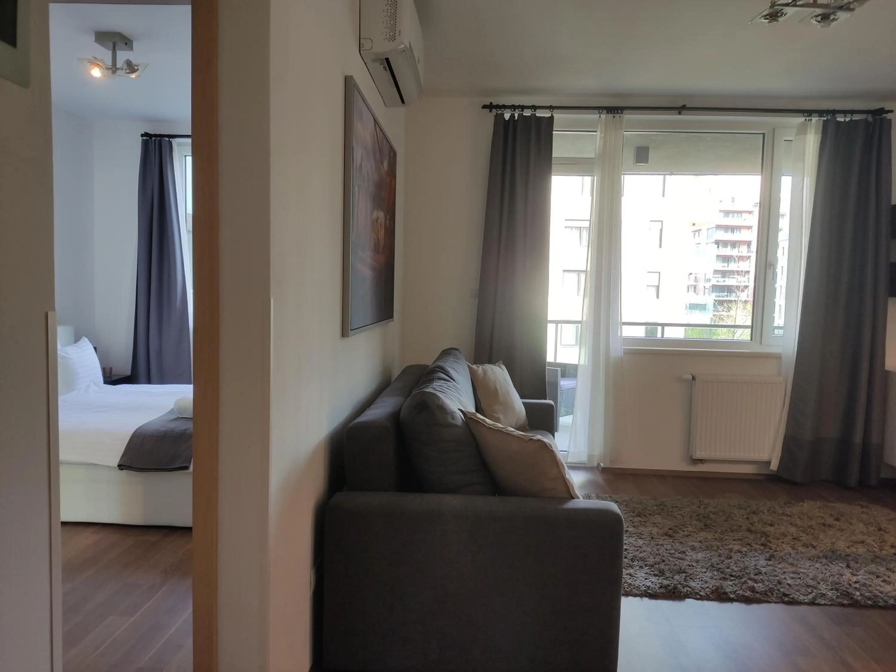 Living room, Bed in Corvin Center Suites