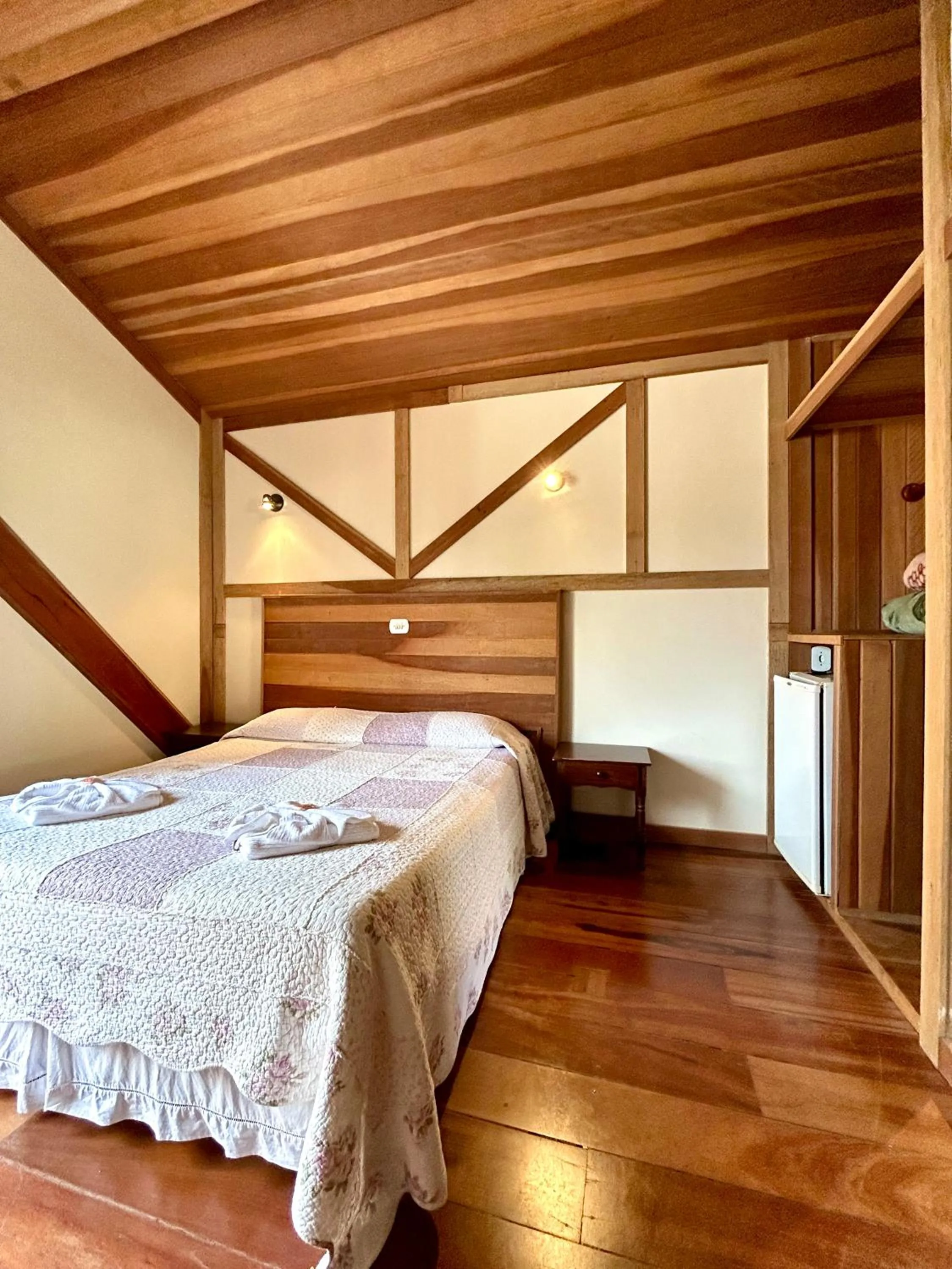 Bed in Pousada dos Esquilos