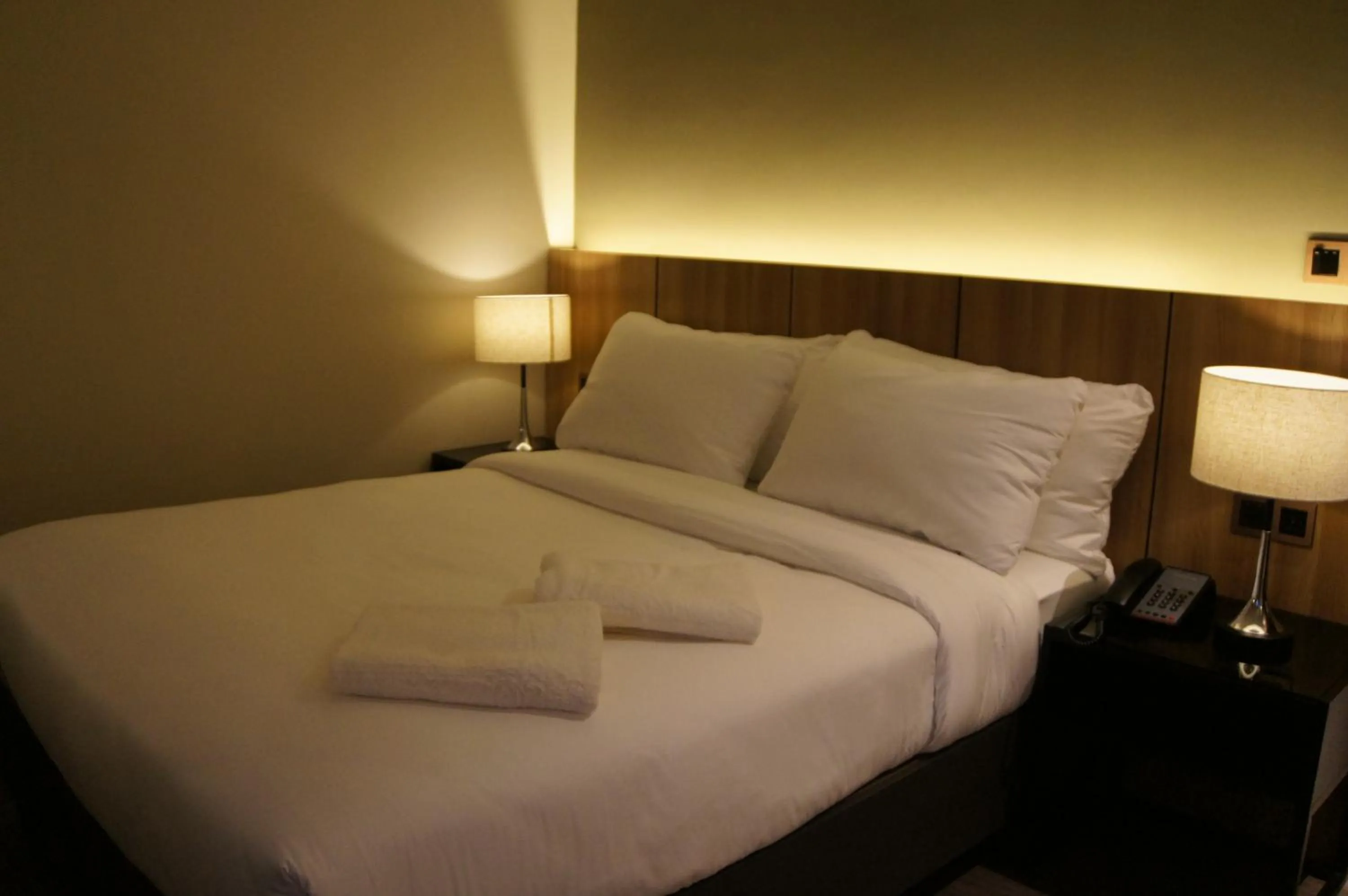 Bed in The Maximilian Hotel