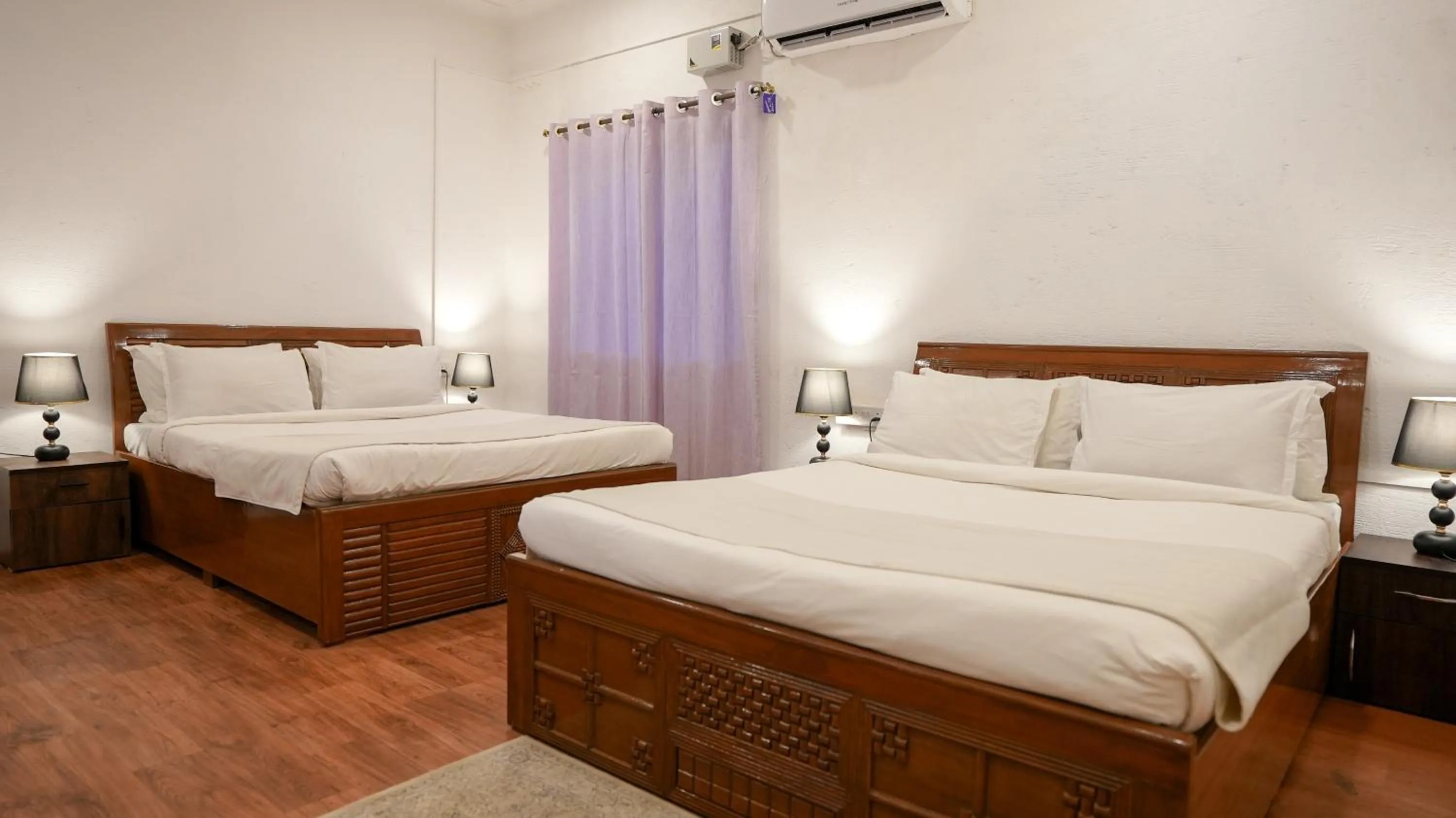 Bed in Whiteflower Resort Morjim