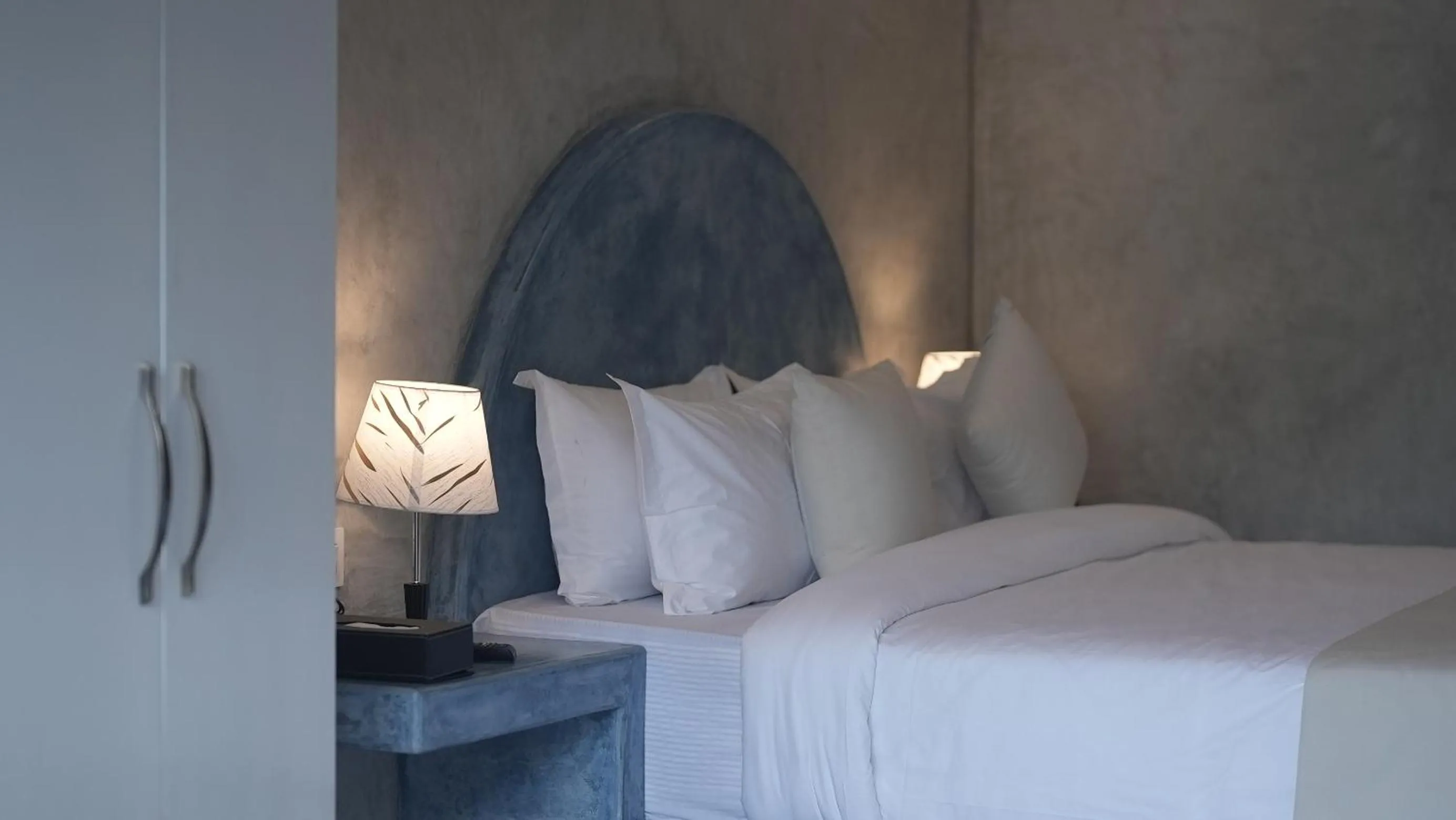 Bed in Whiteflower Resort Morjim