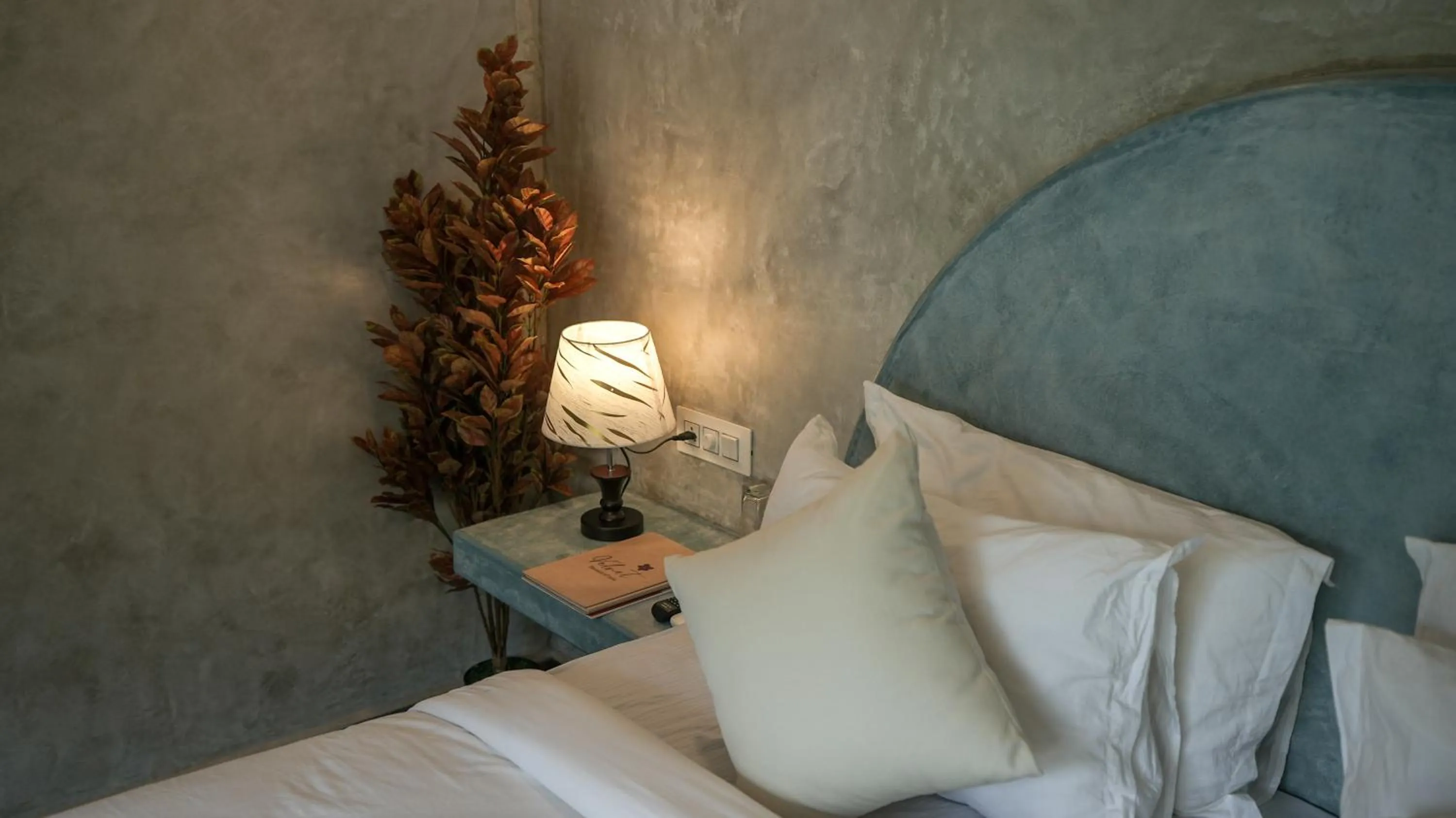 Bed in Whiteflower Resort Morjim