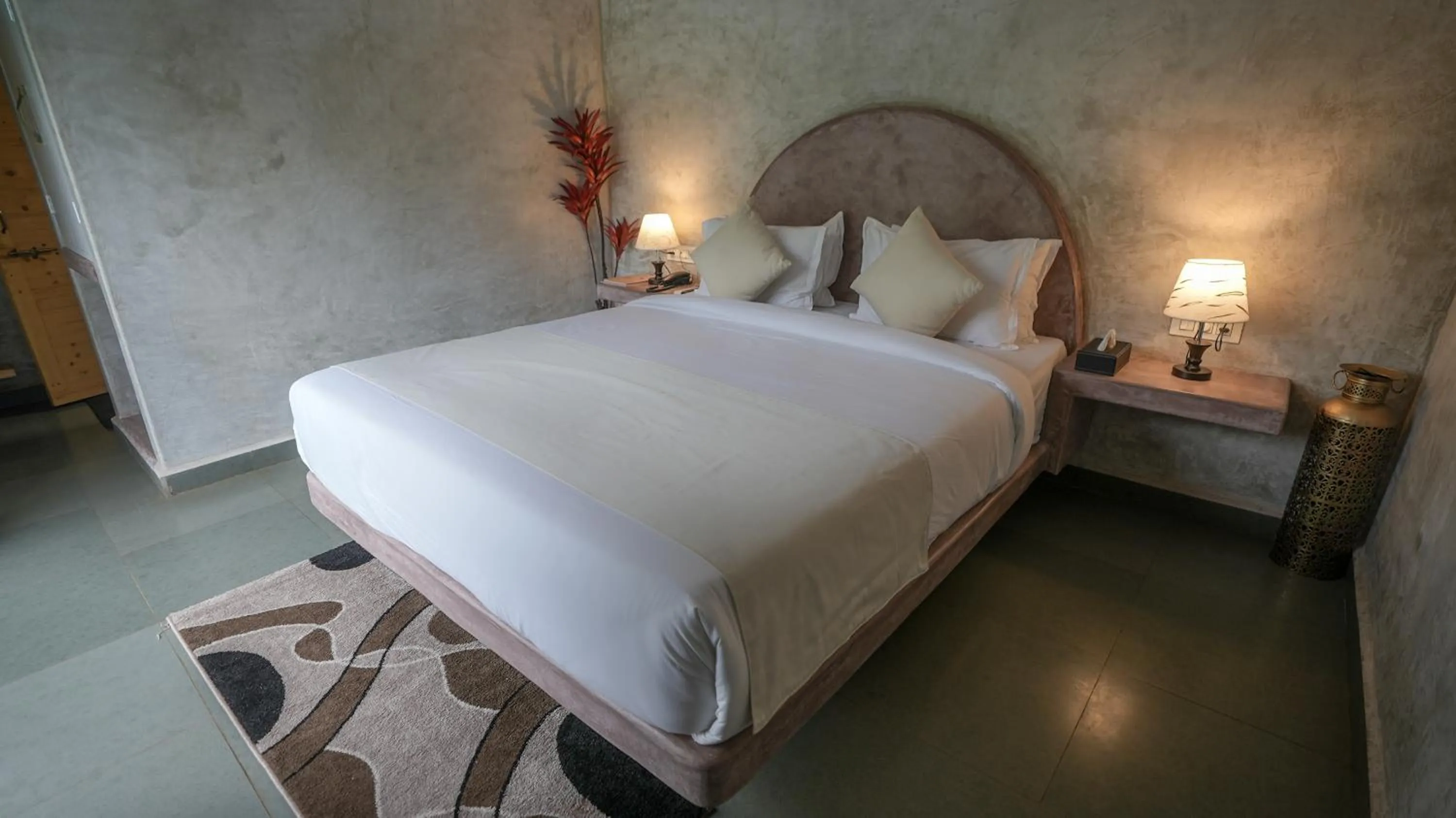 Bed in Whiteflower Resort Morjim