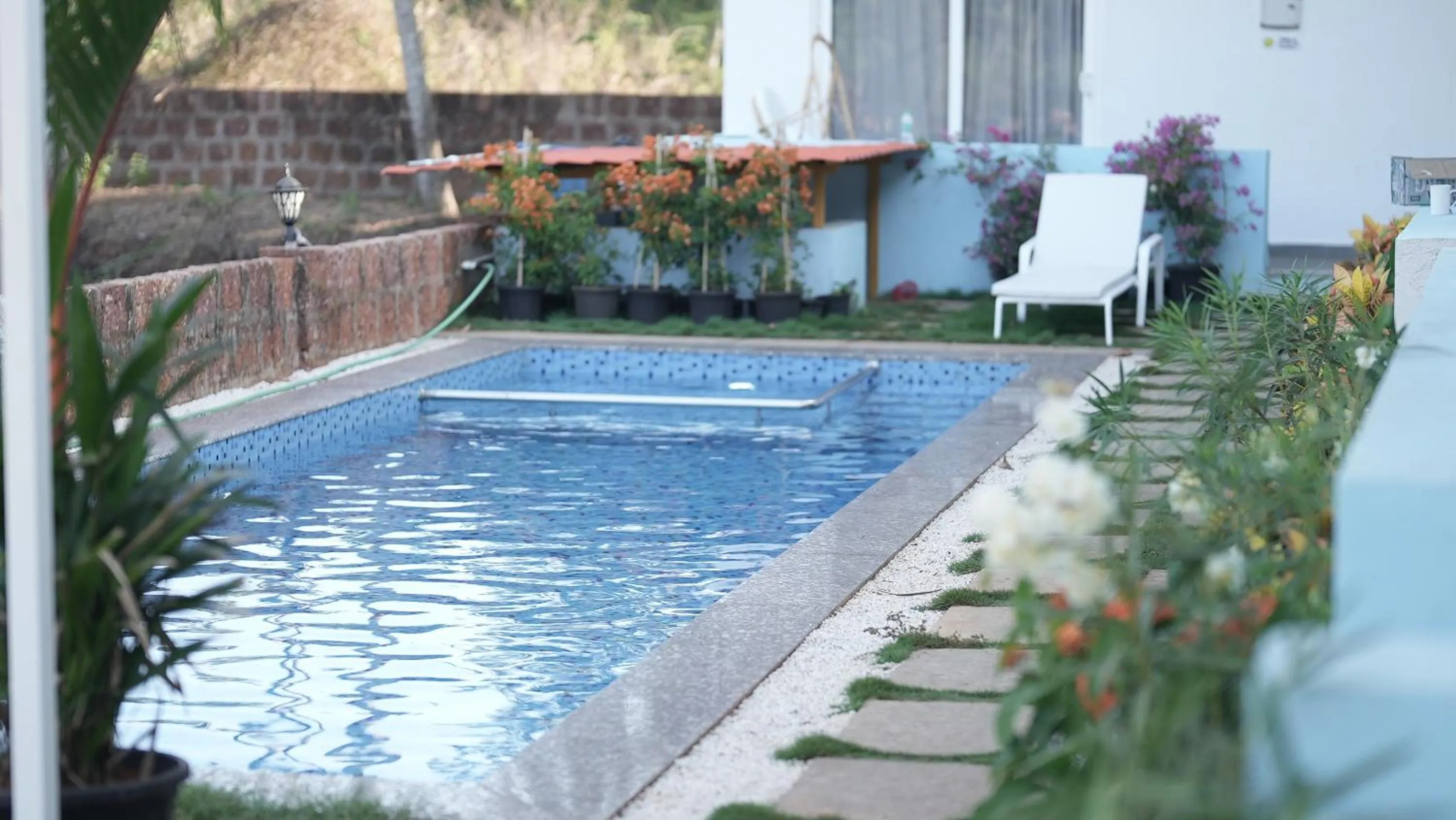 Swimming pool in Whiteflower Resort Morjim