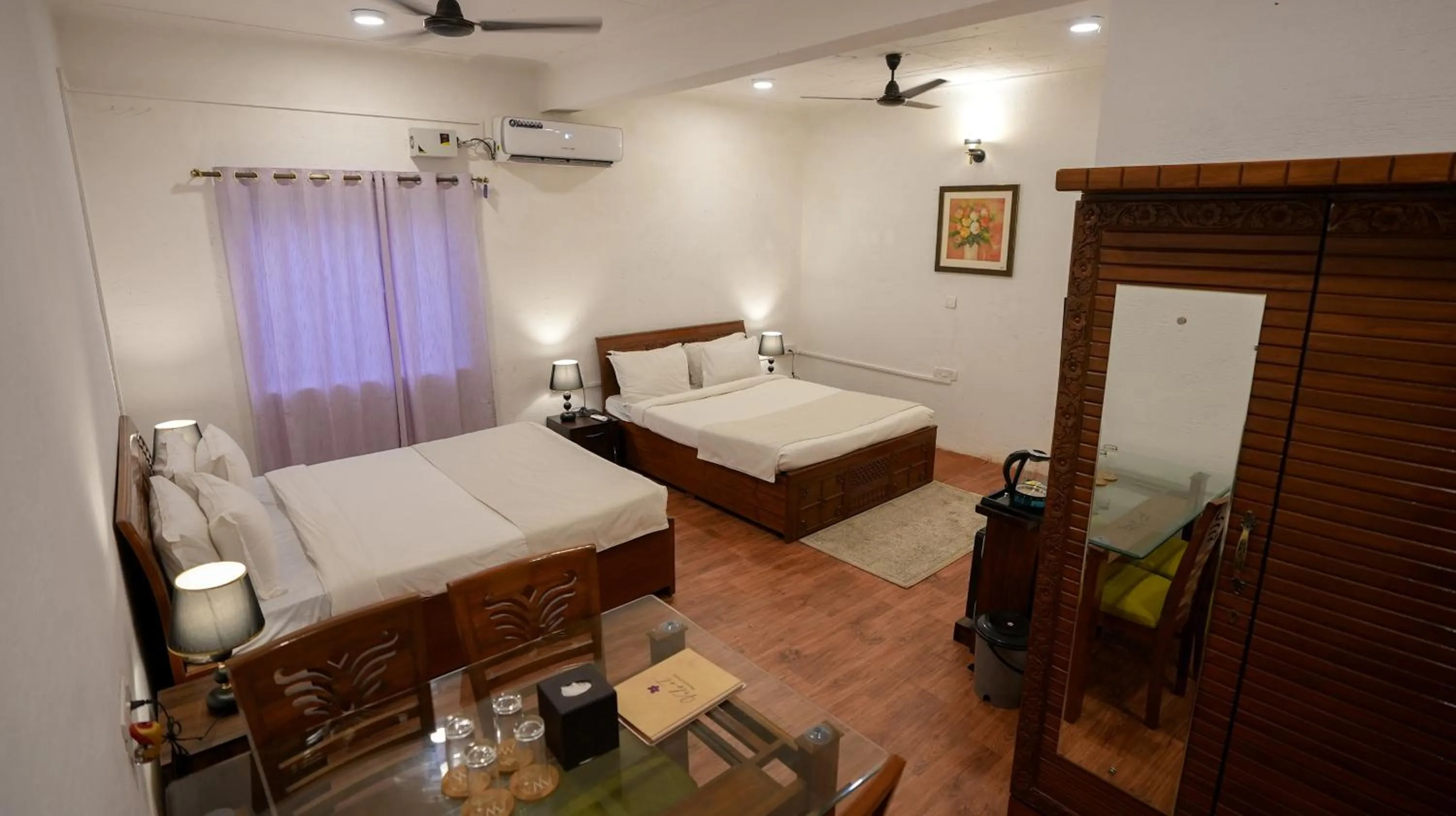 Bed in Whiteflower Resort Morjim