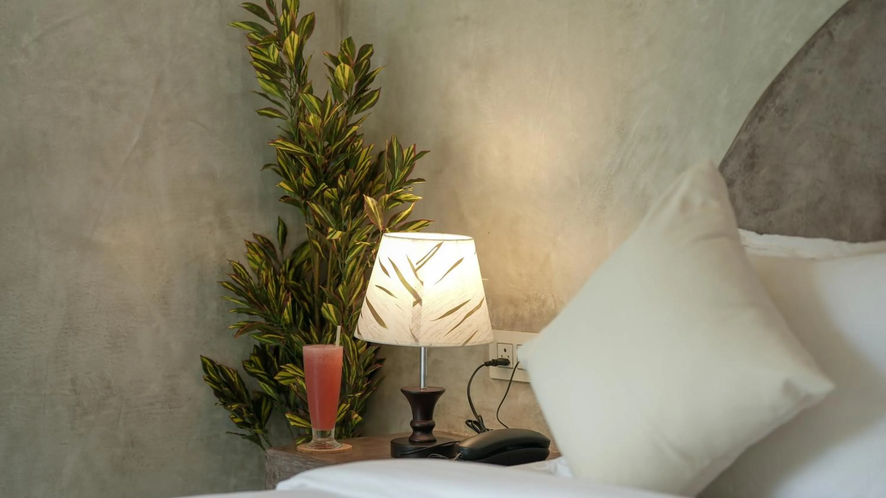 Bed in Whiteflower Resort Morjim