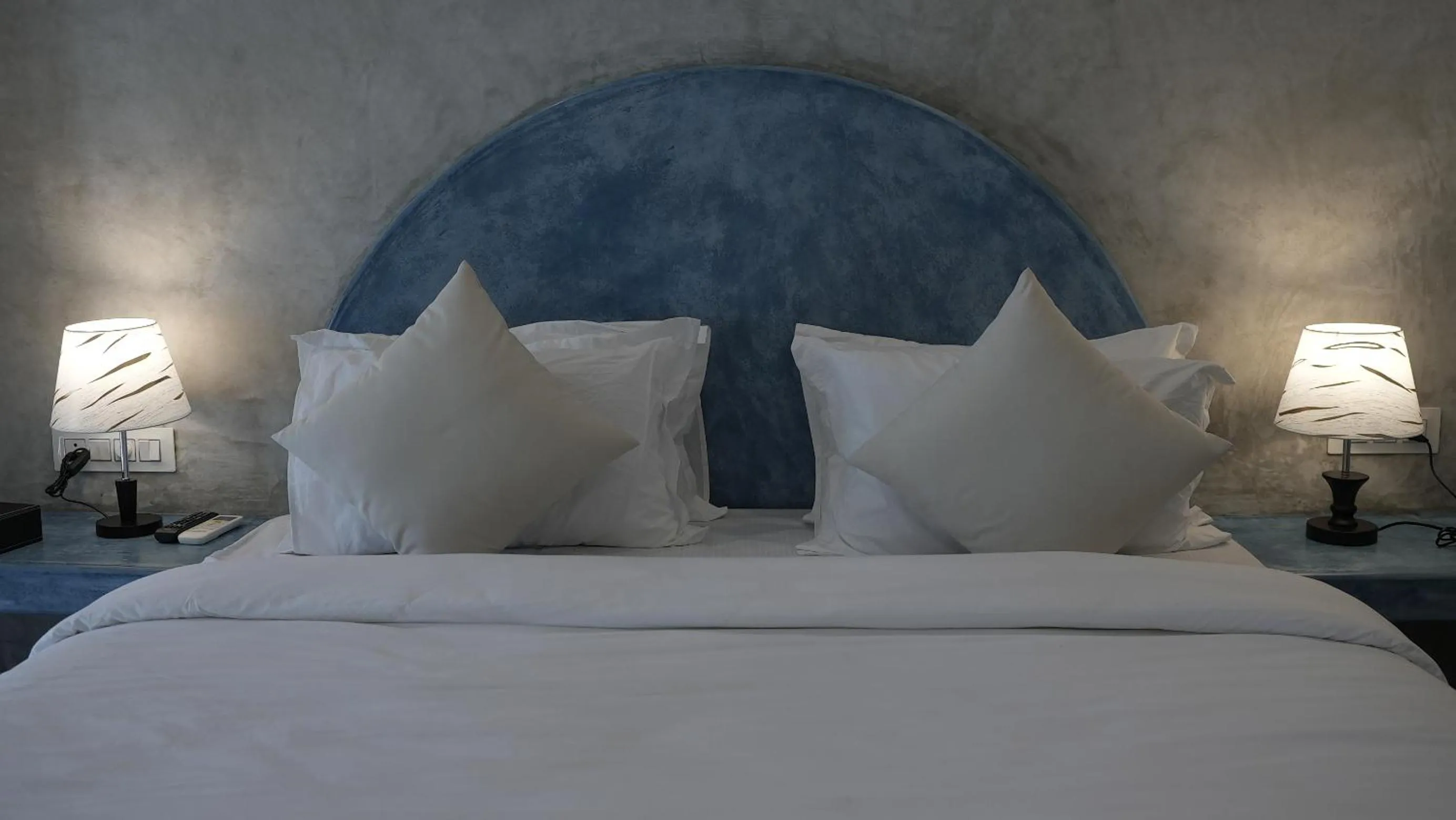 Bed in Whiteflower Resort Morjim