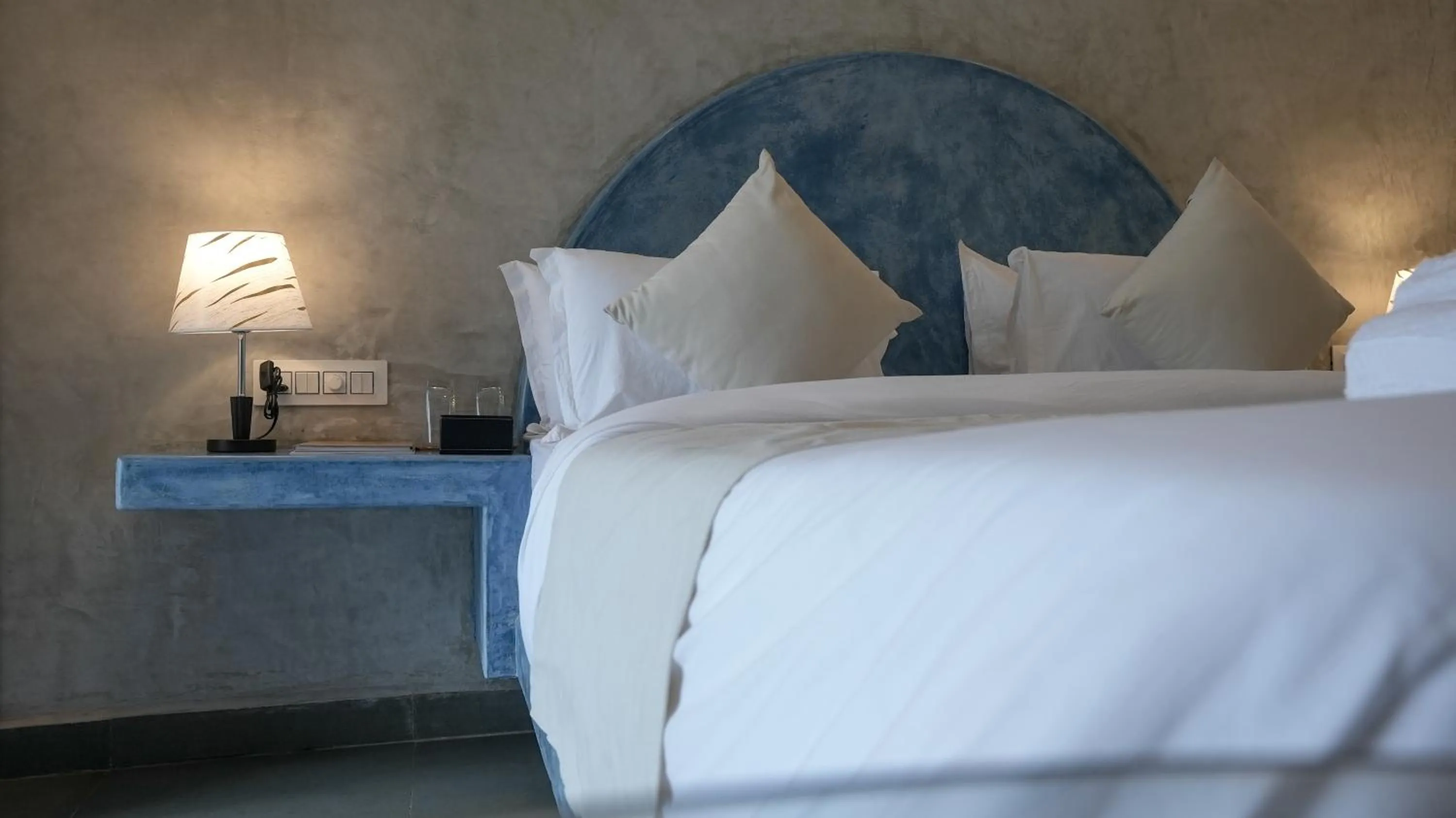 Bed in Whiteflower Resort Morjim