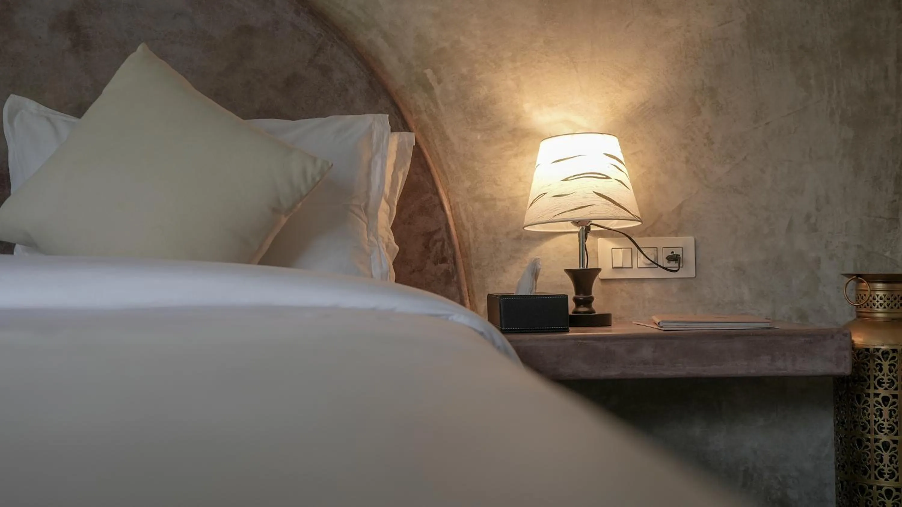 Bed in Whiteflower Resort Morjim