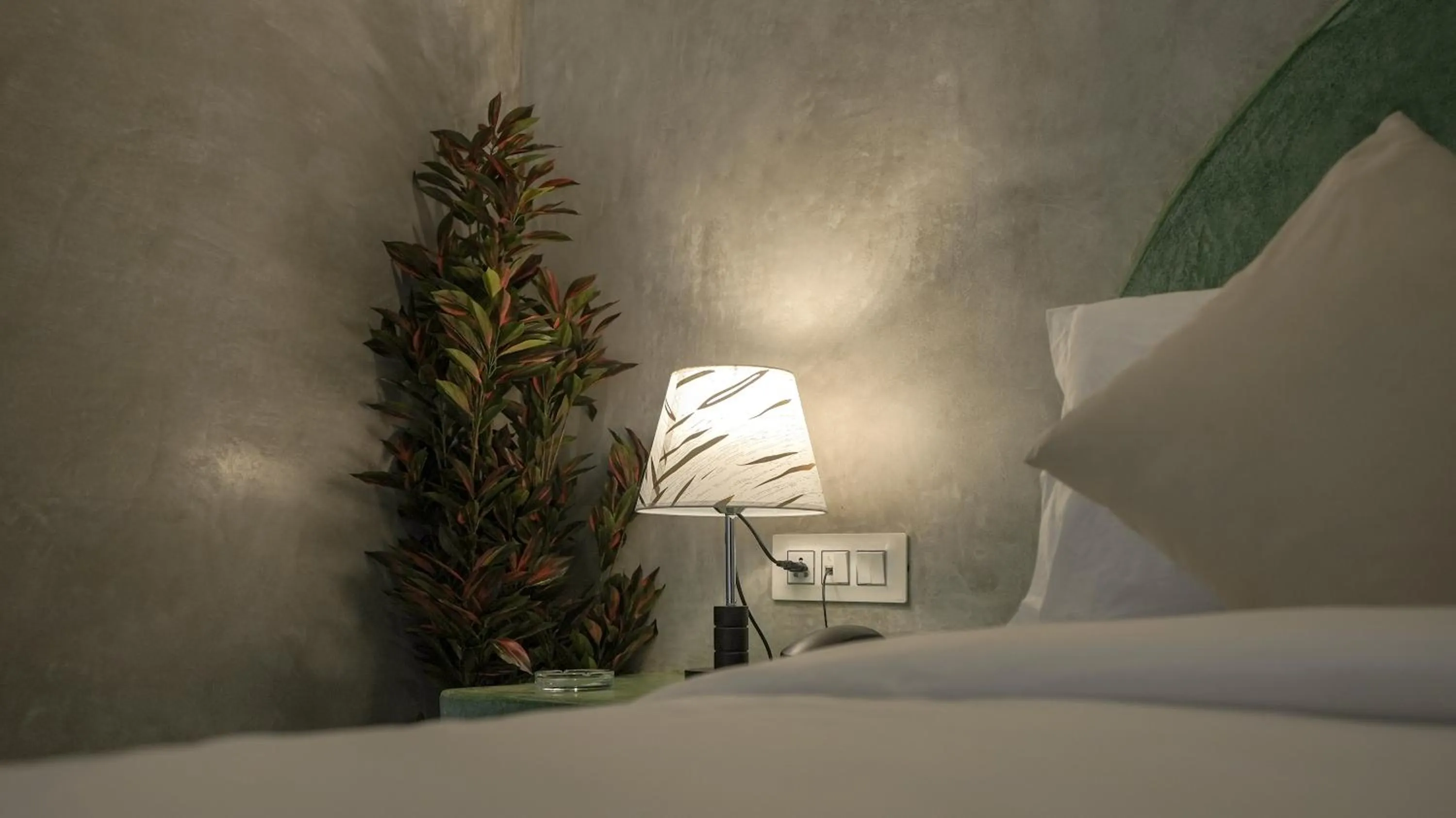 Bed in Whiteflower Resort Morjim