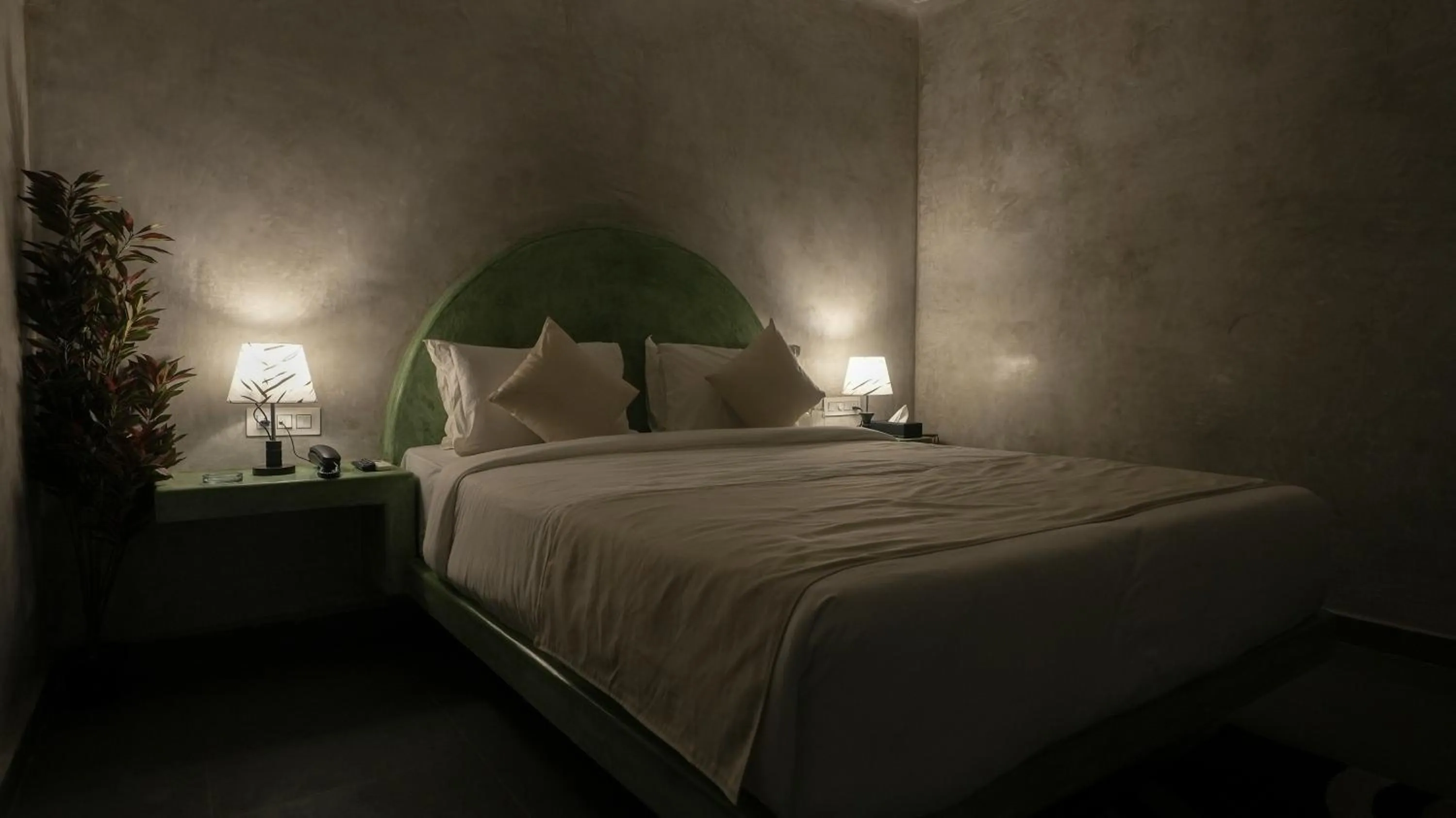 Bed in Whiteflower Resort Morjim