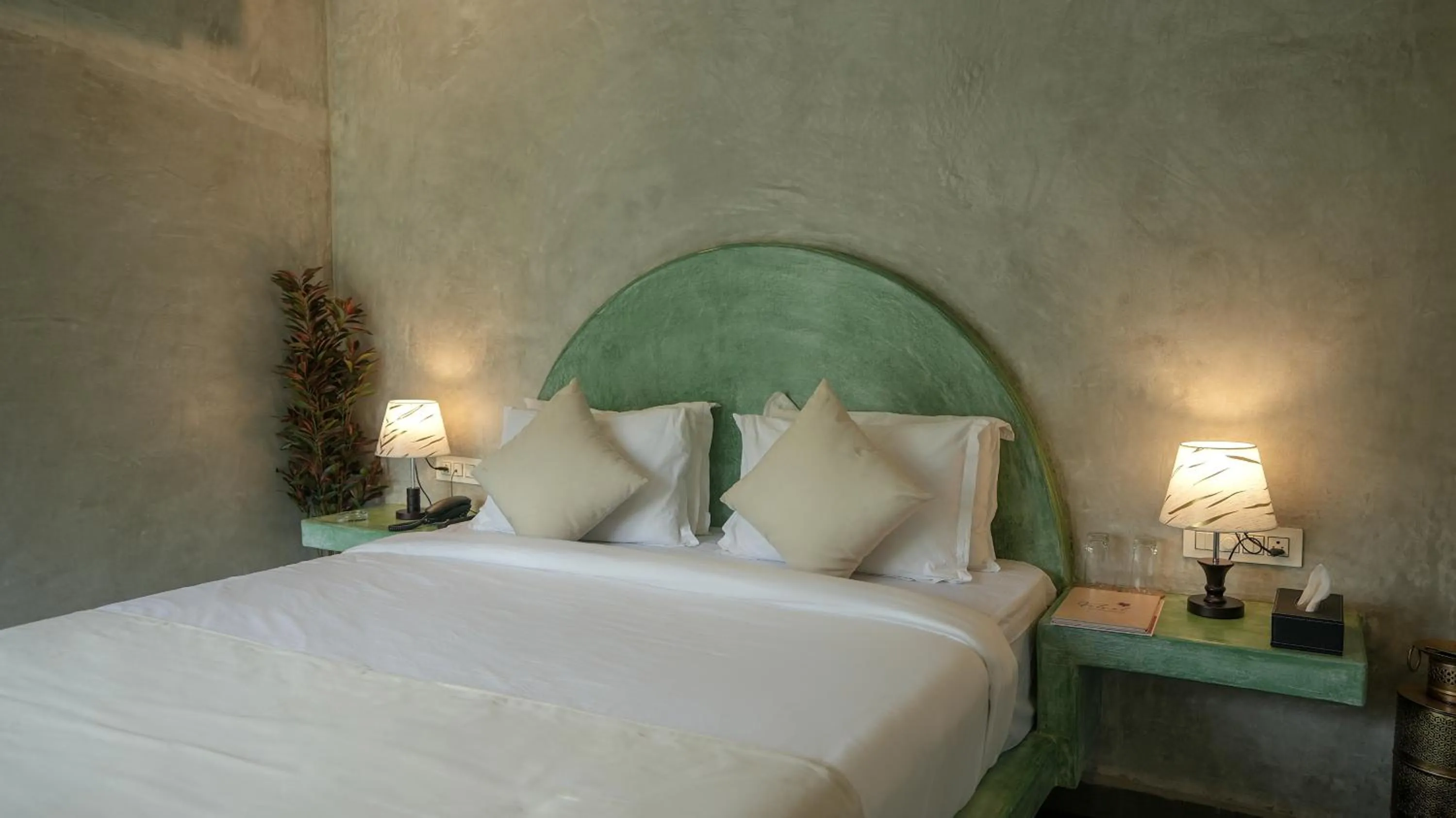 Bed in Whiteflower Resort Morjim