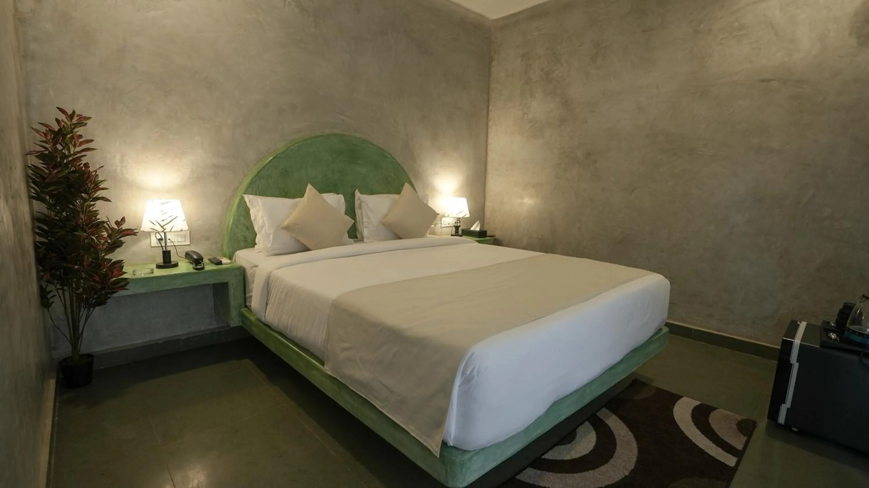 Bed in Whiteflower Resort Morjim