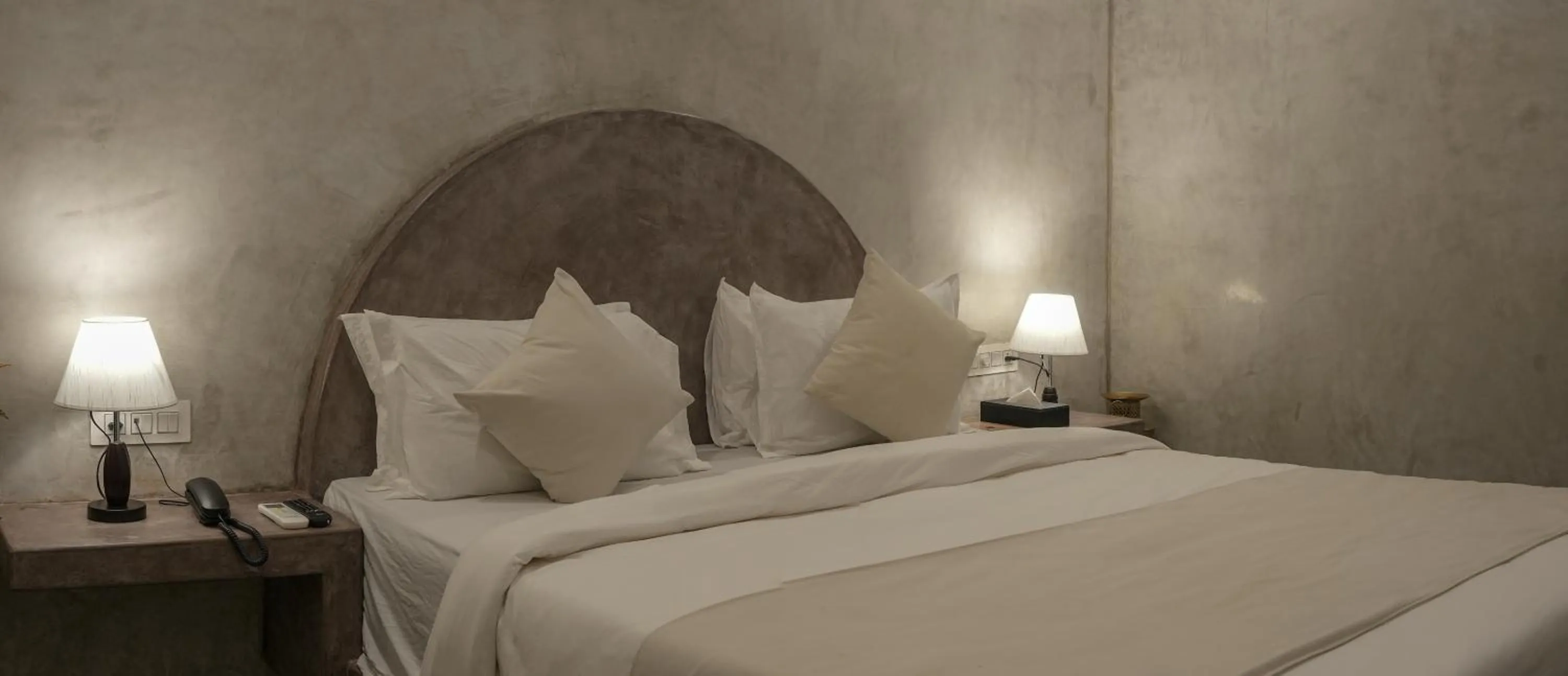 Bed in Whiteflower Resort Morjim