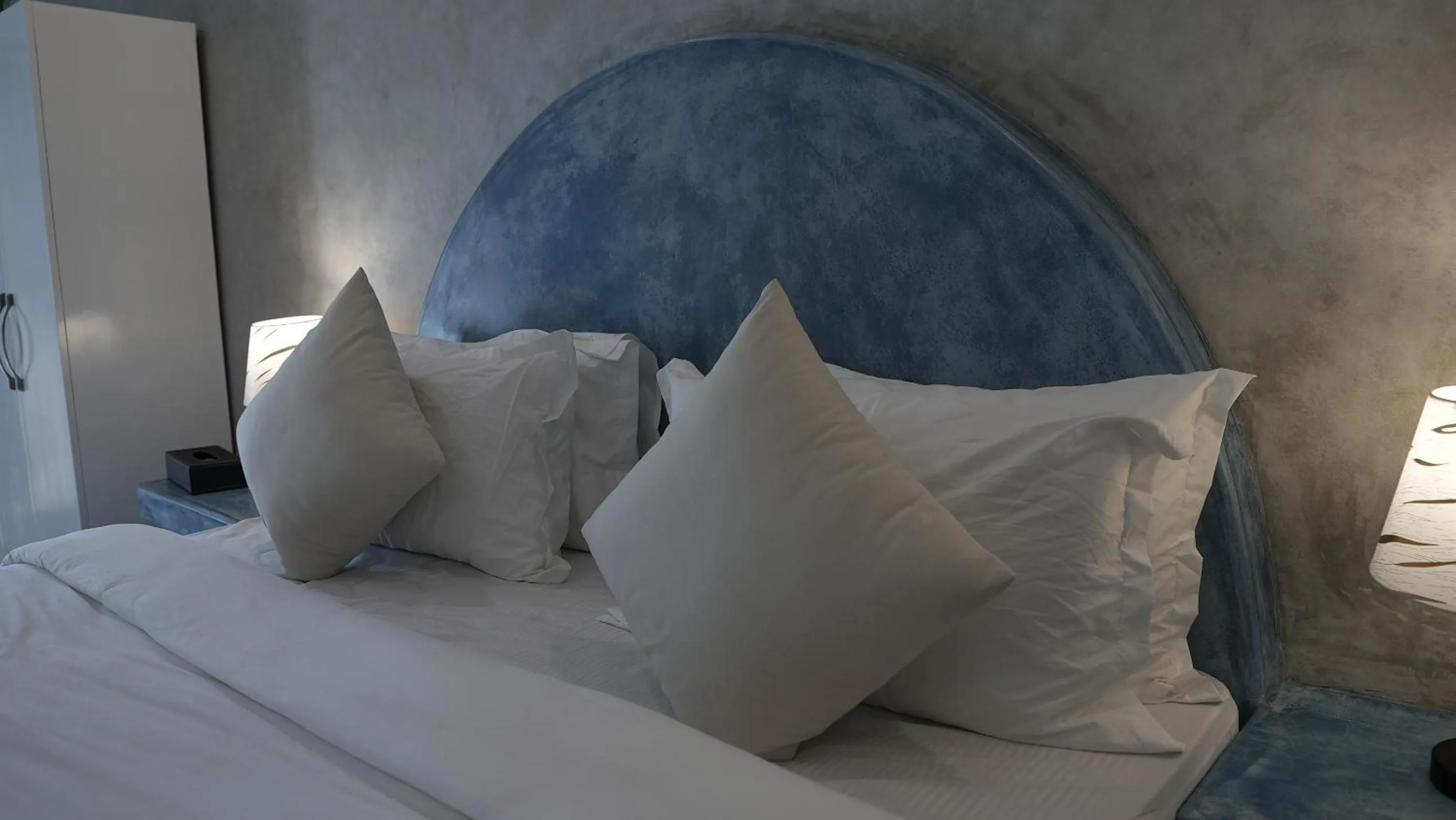 Bed in Whiteflower Resort Morjim