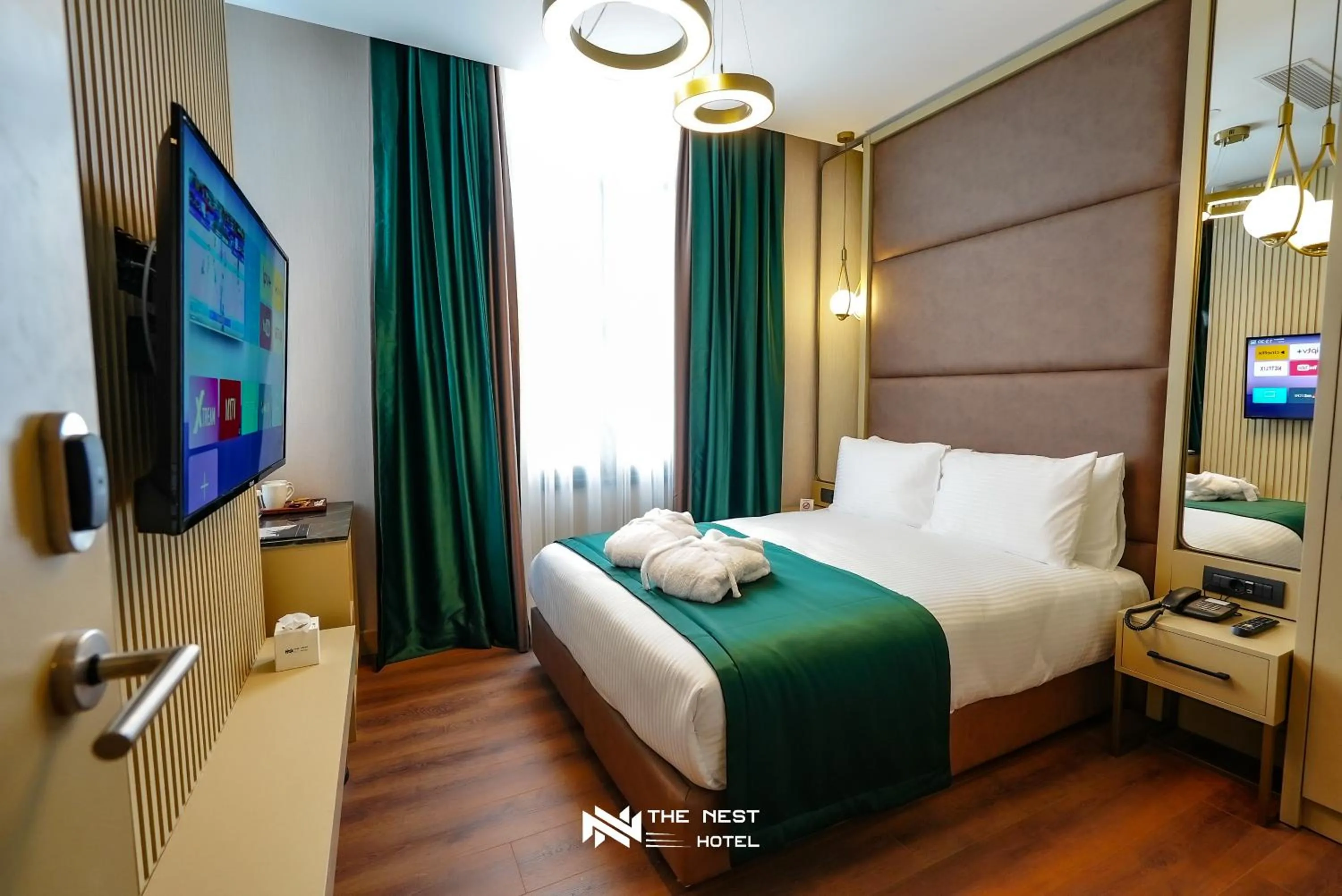 Bed in THE NEST HOTEL