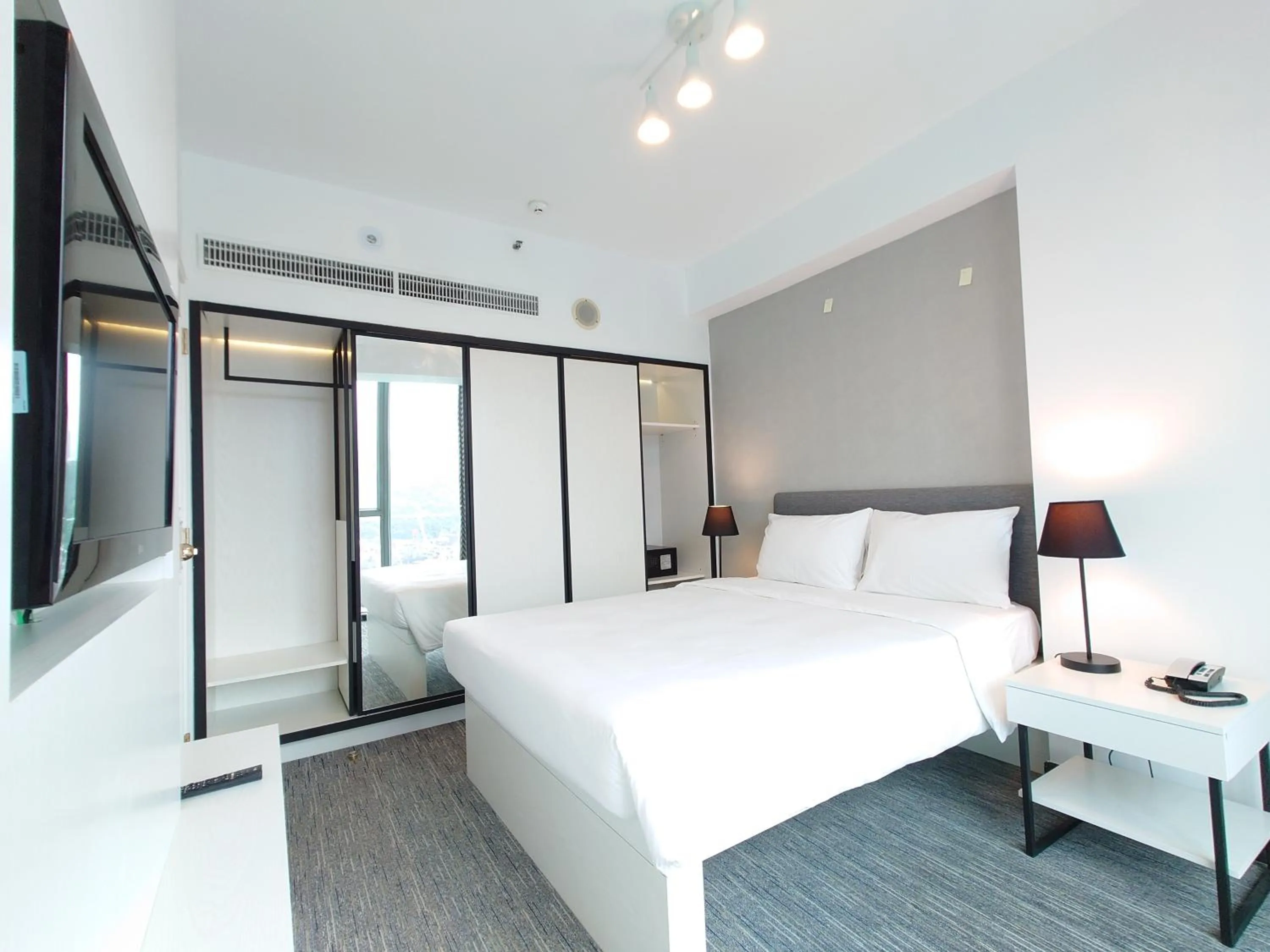 Bed in Grand Bay View Hotel