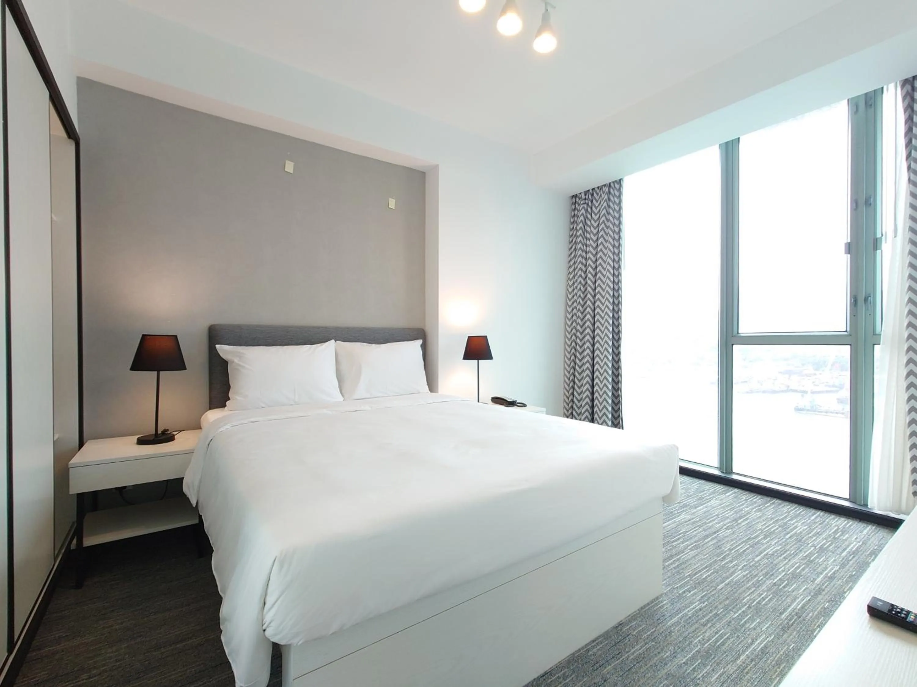 Bed in Grand Bay View Hotel