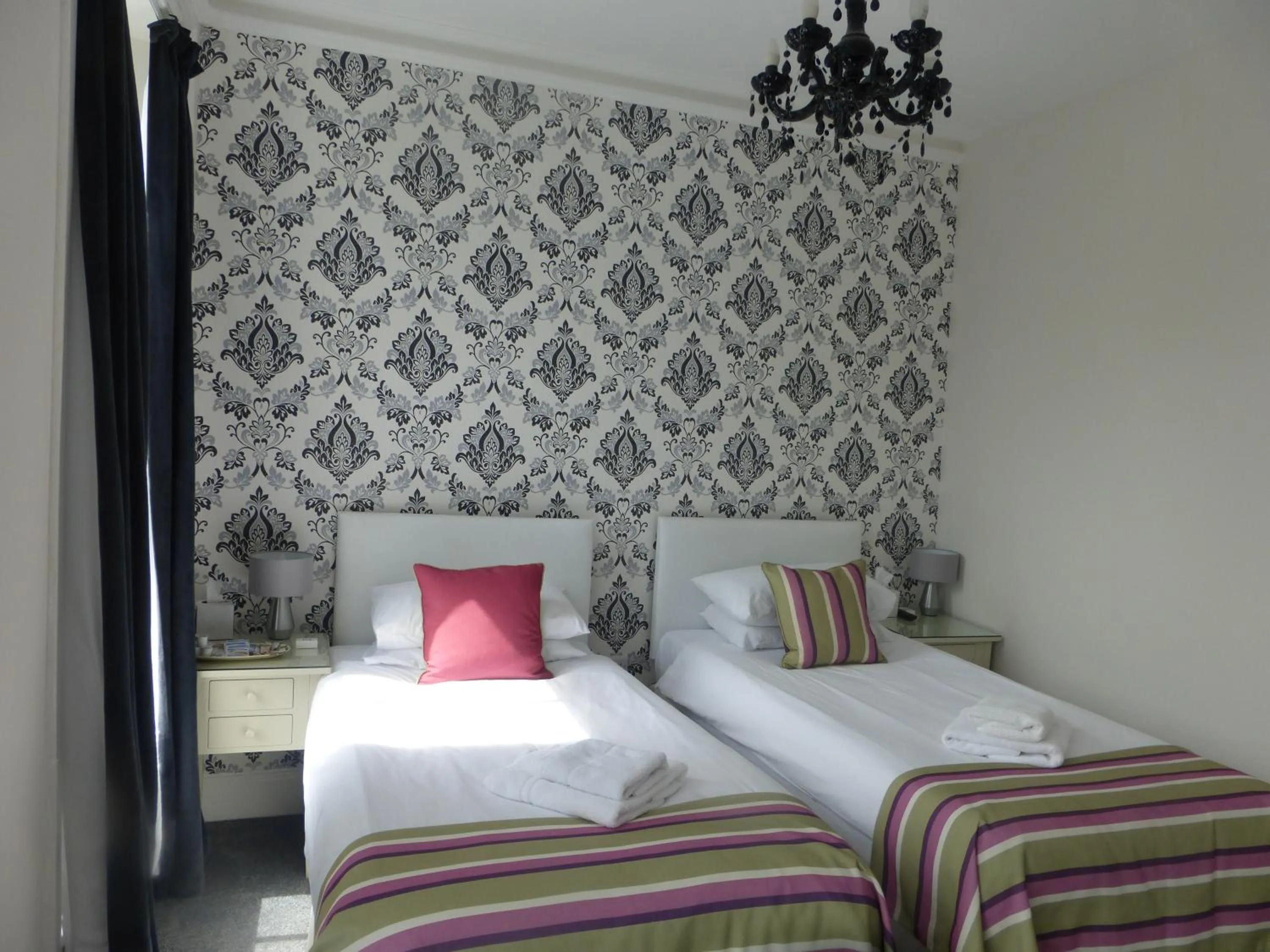 Bed in Harry's Hotel & Restaurant