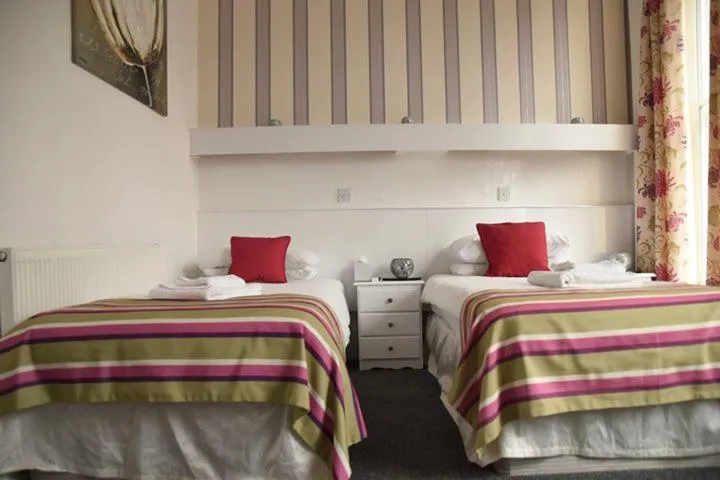 Bed in Harry's Hotel & Restaurant