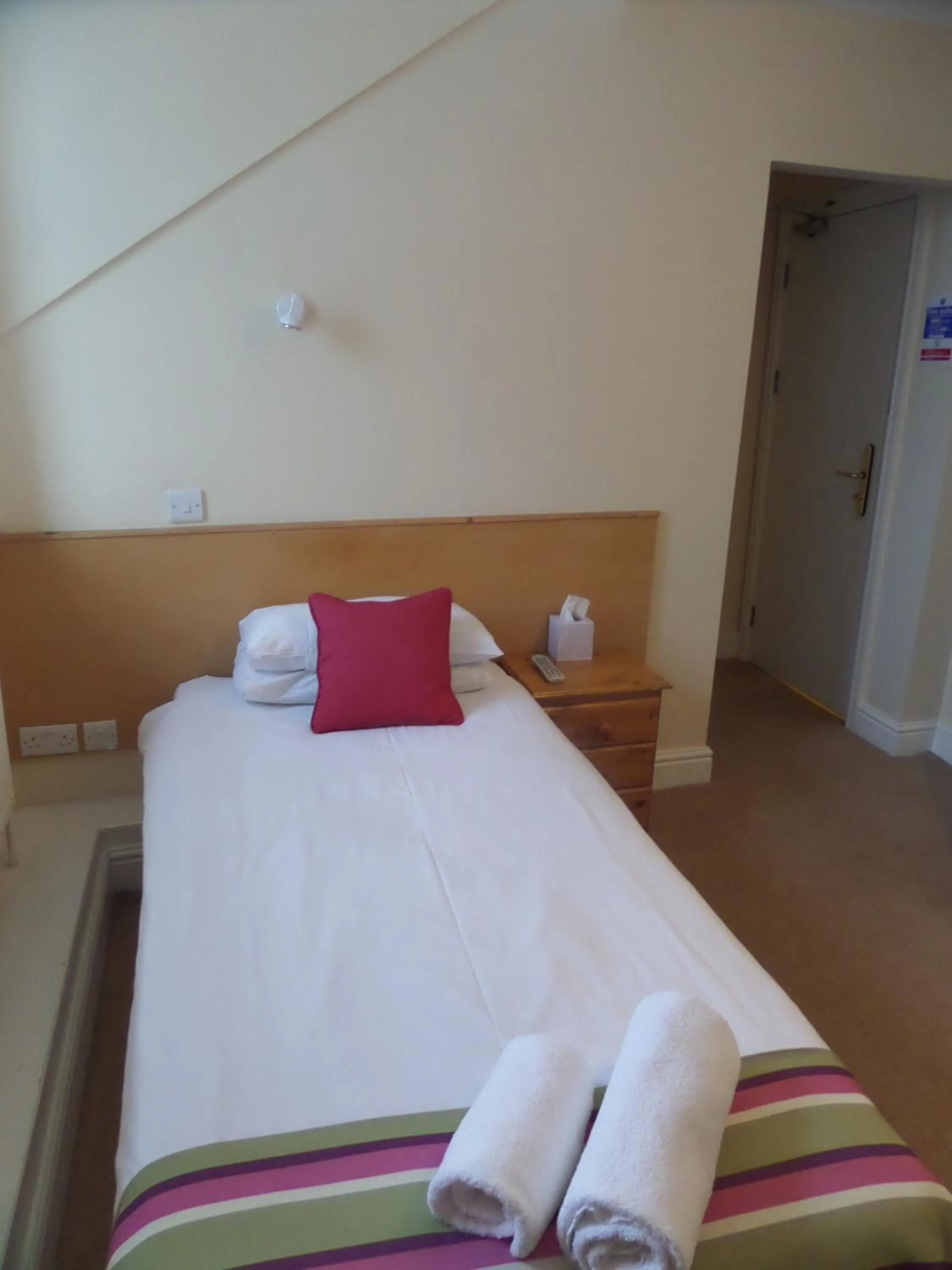 Bed in Harry's Hotel & Restaurant