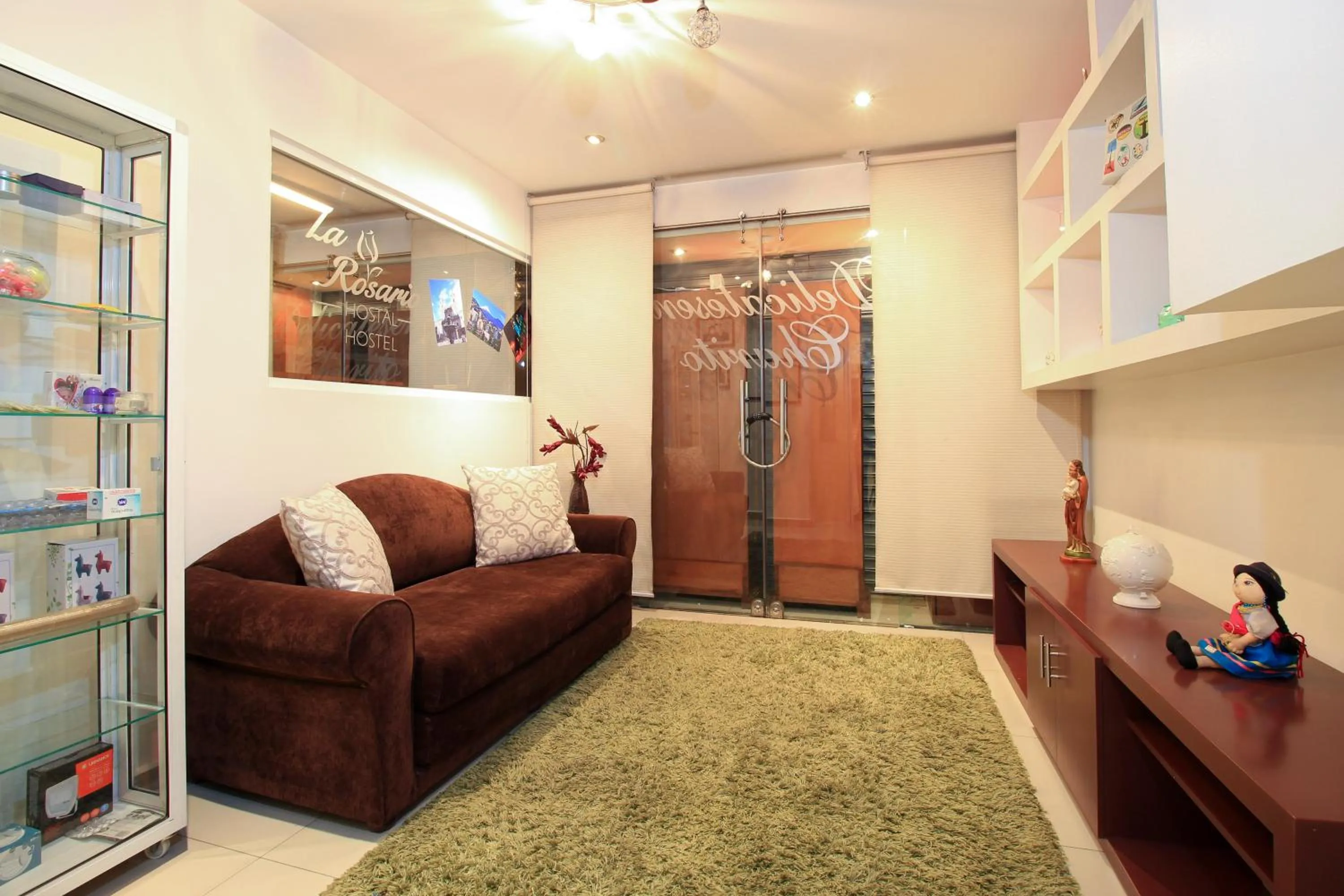 Communal lounge/ TV room in La Rosario Hostal