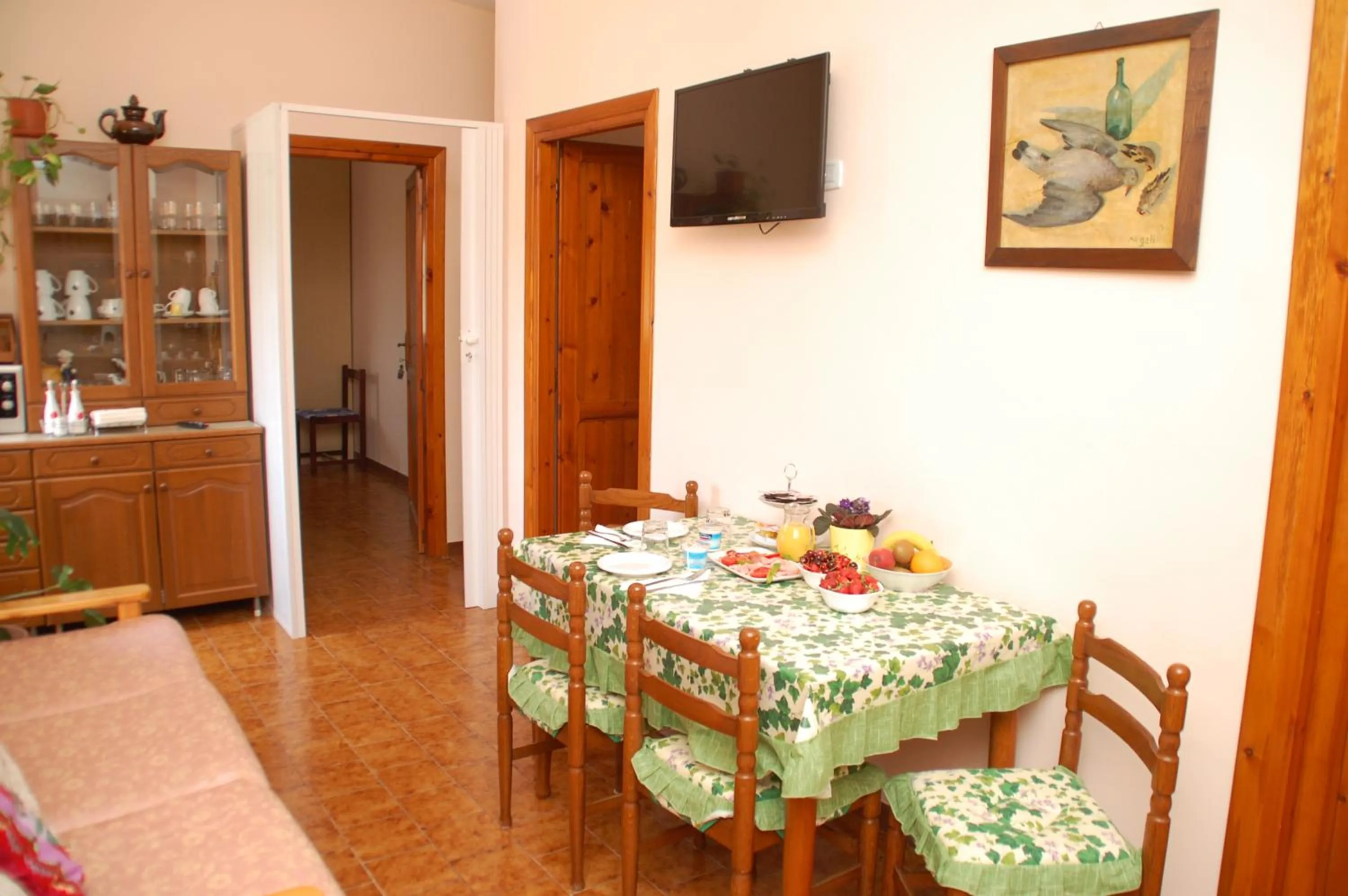 Communal lounge/ TV room in B&B Villa Claudia