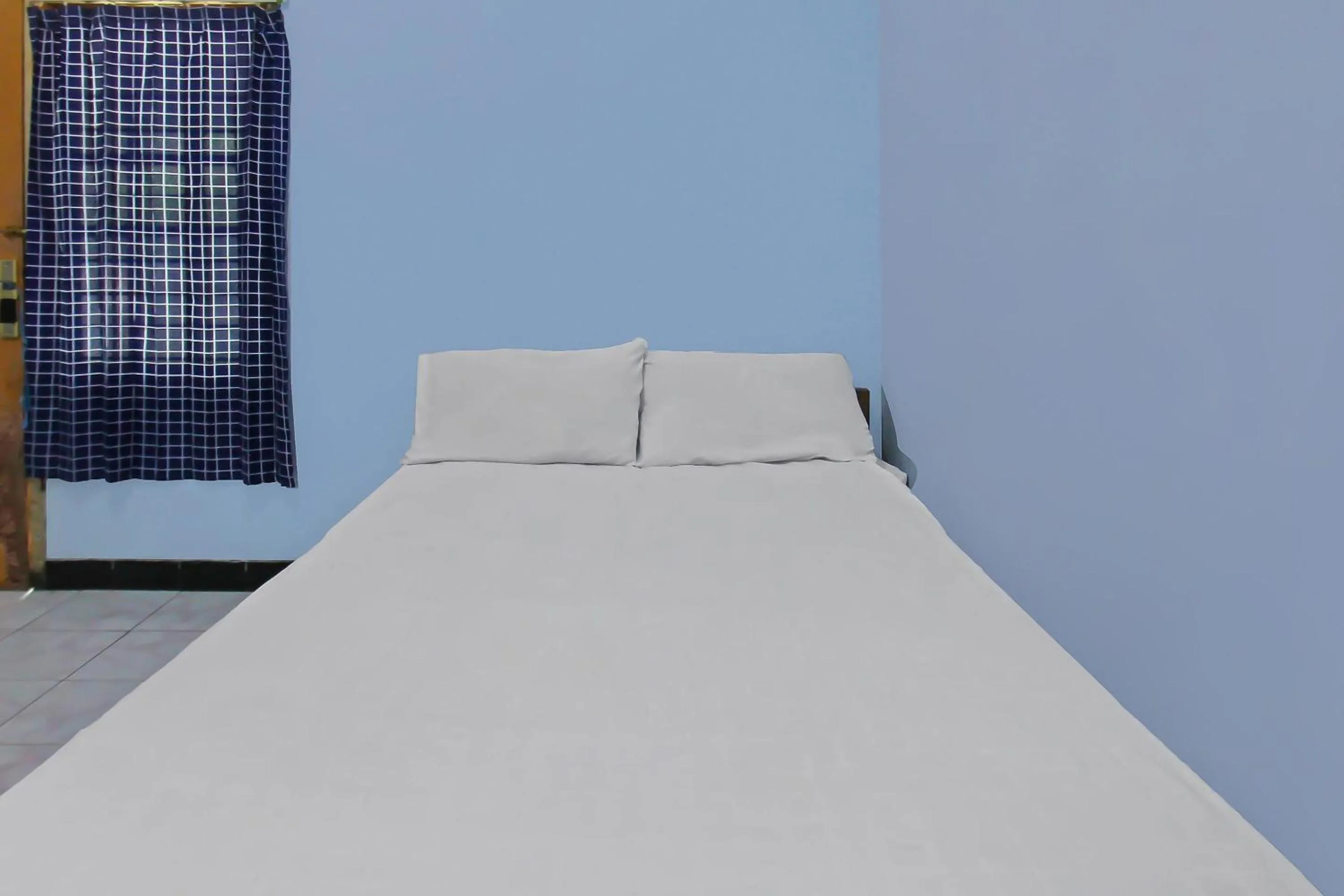 Bedroom, Bed in Hotel O Jati Homestay Near Taman Suranadi